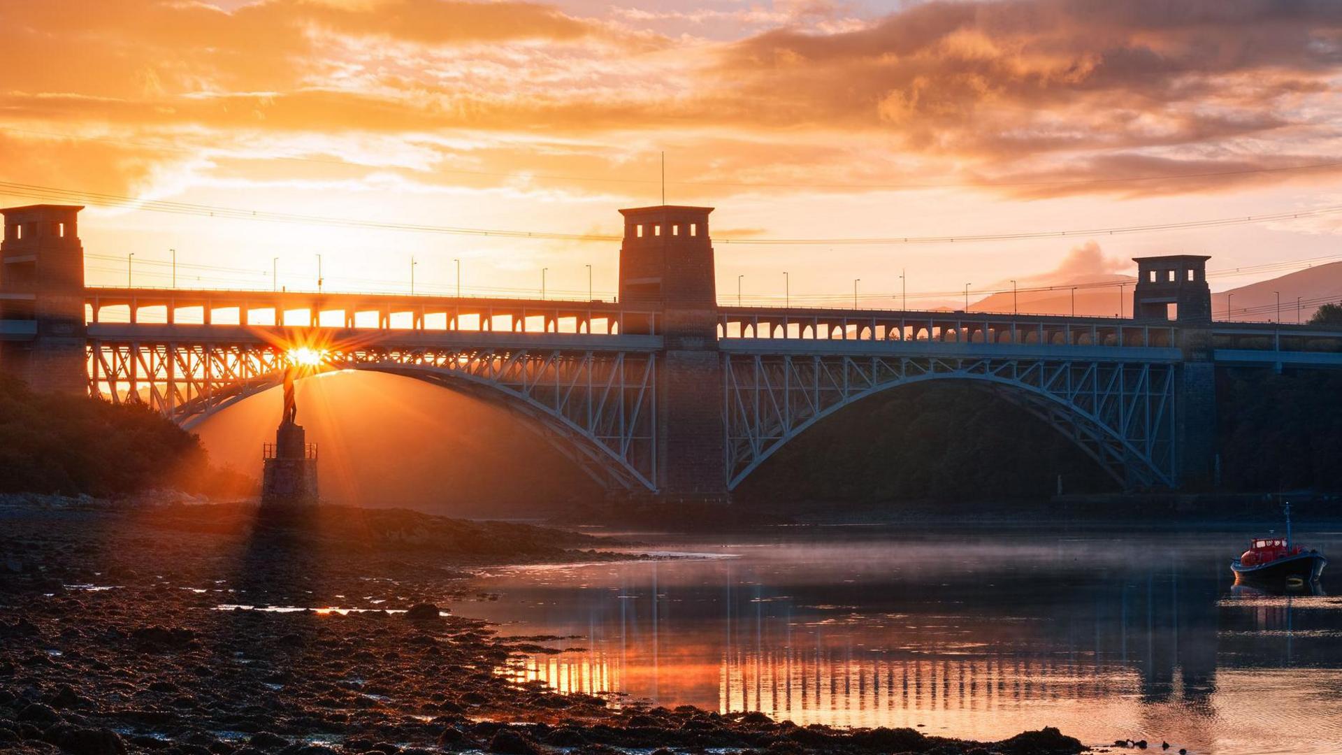 A view of the Britannia Bridge on the Menai Straight at night.