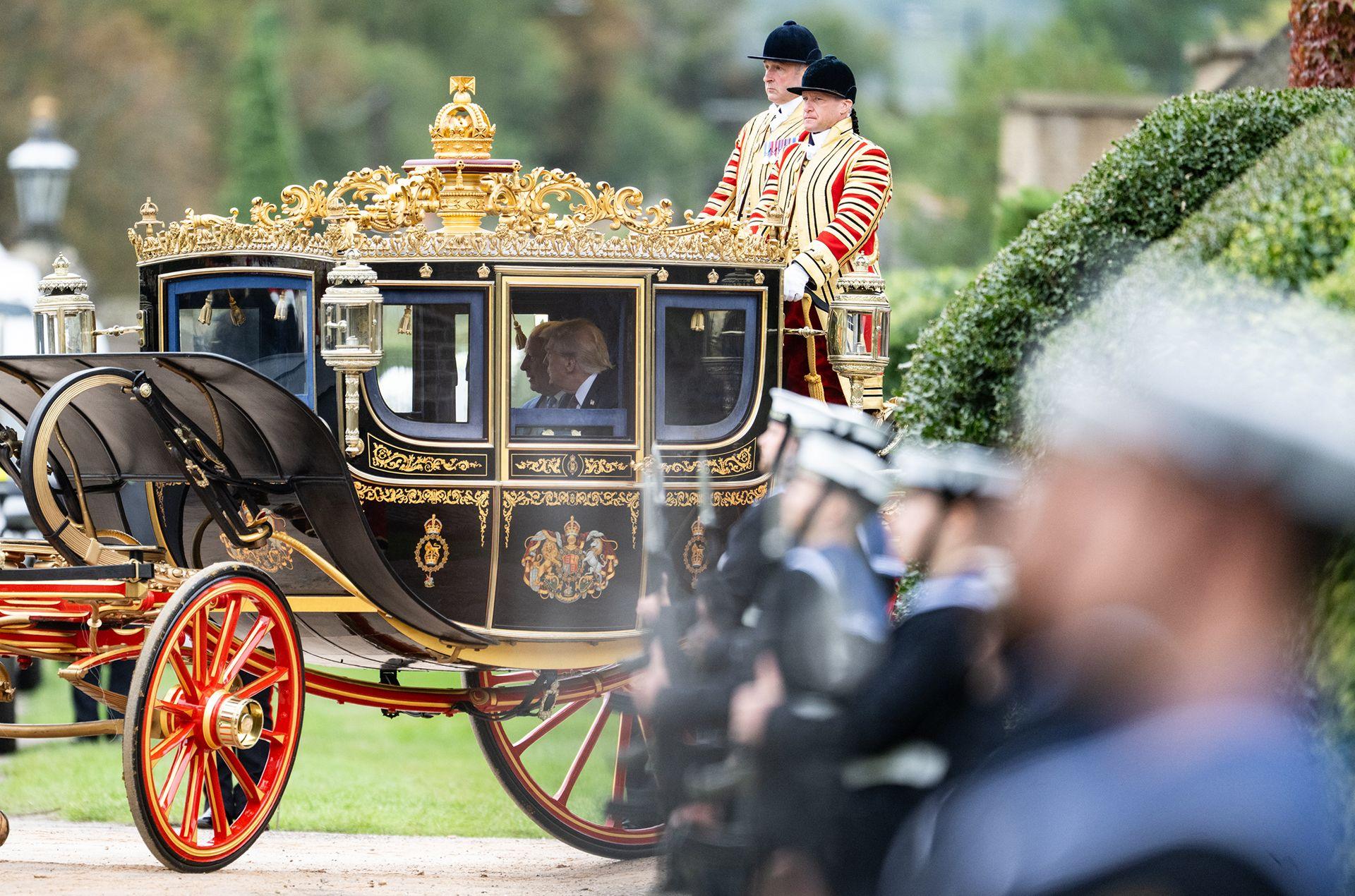 King Charles III and U.S. President Donald Trump in a carriage during the carriage procession during the State visit by the President of the United States of America at Windsor Castle on September 17, 2025 in Windsor, England. 