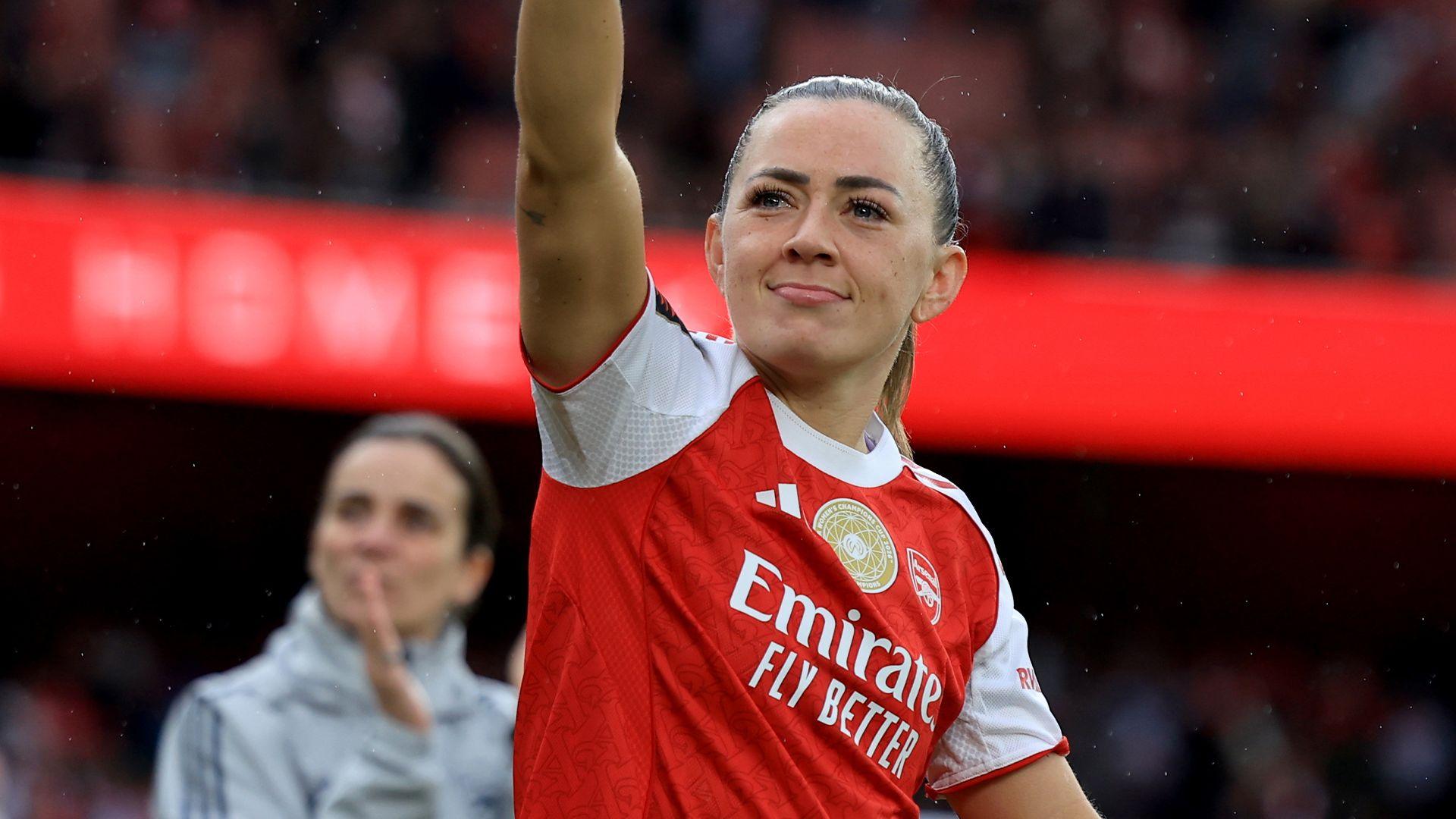 Katie McCabe waves at fans