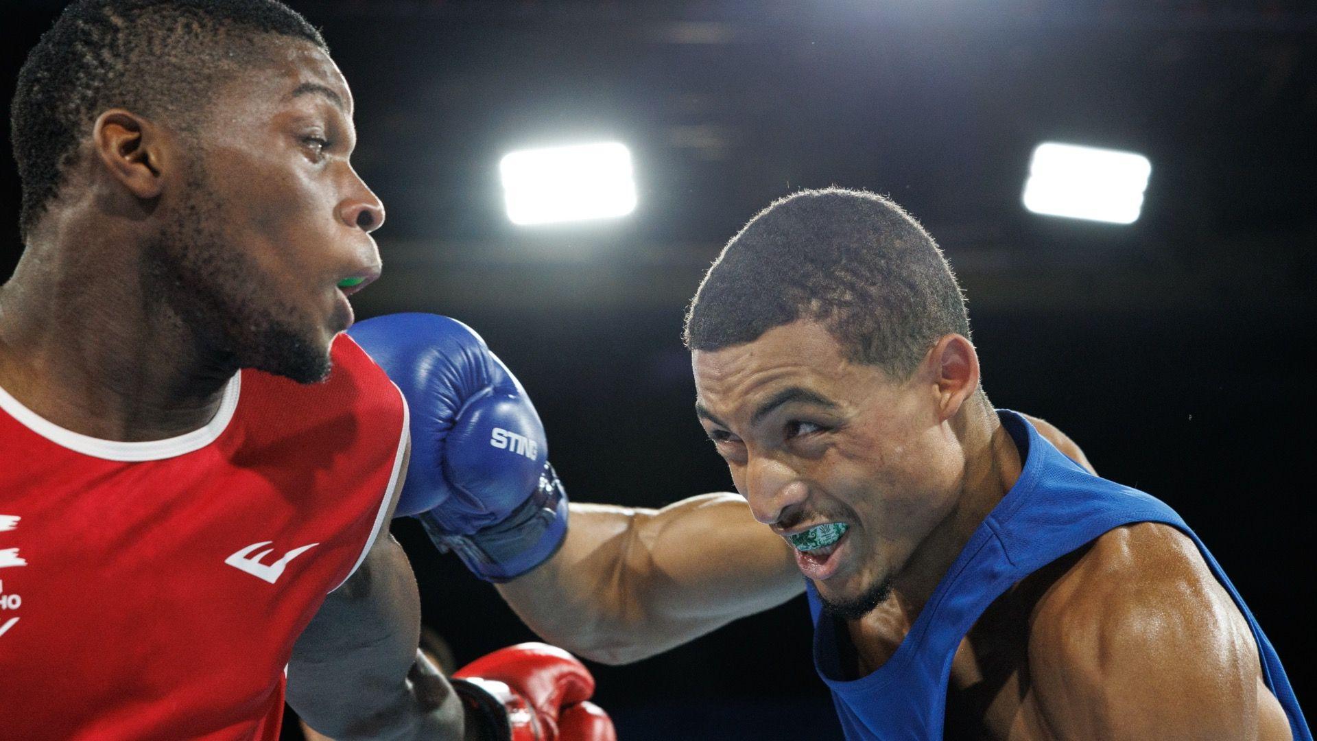 Orlando Holley-Sotomi lands a punch on opponent Refiloe Thai.