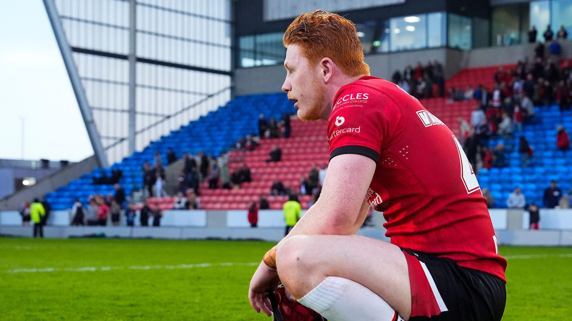 Salford's Jonny Vaughan kneels dejected after a Salford defeat