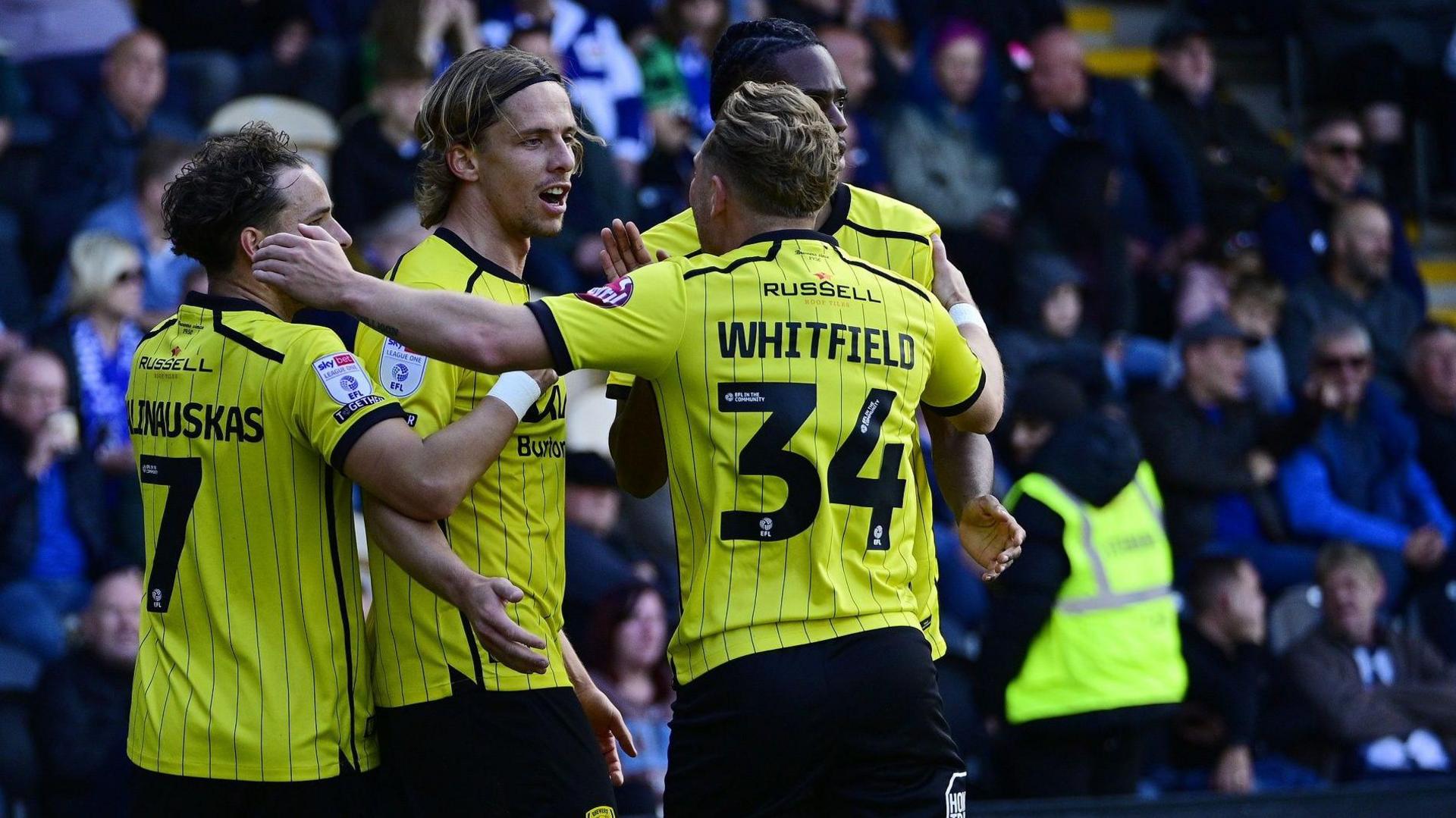 Burton Albion players celebrate a goal