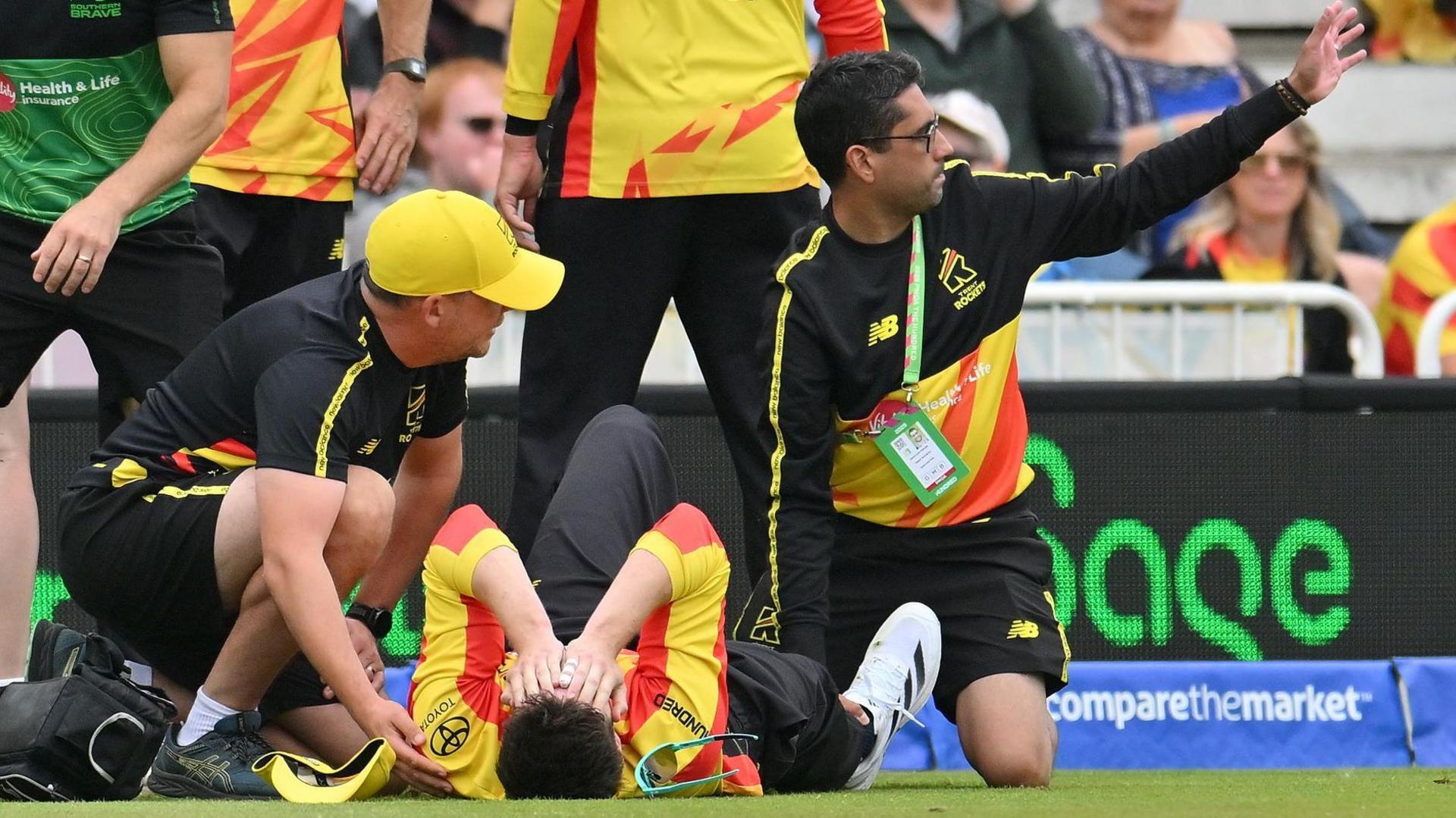 Adam Hose lies on the ground injured after dislocating his ankle while fielding for Trent Rockets 