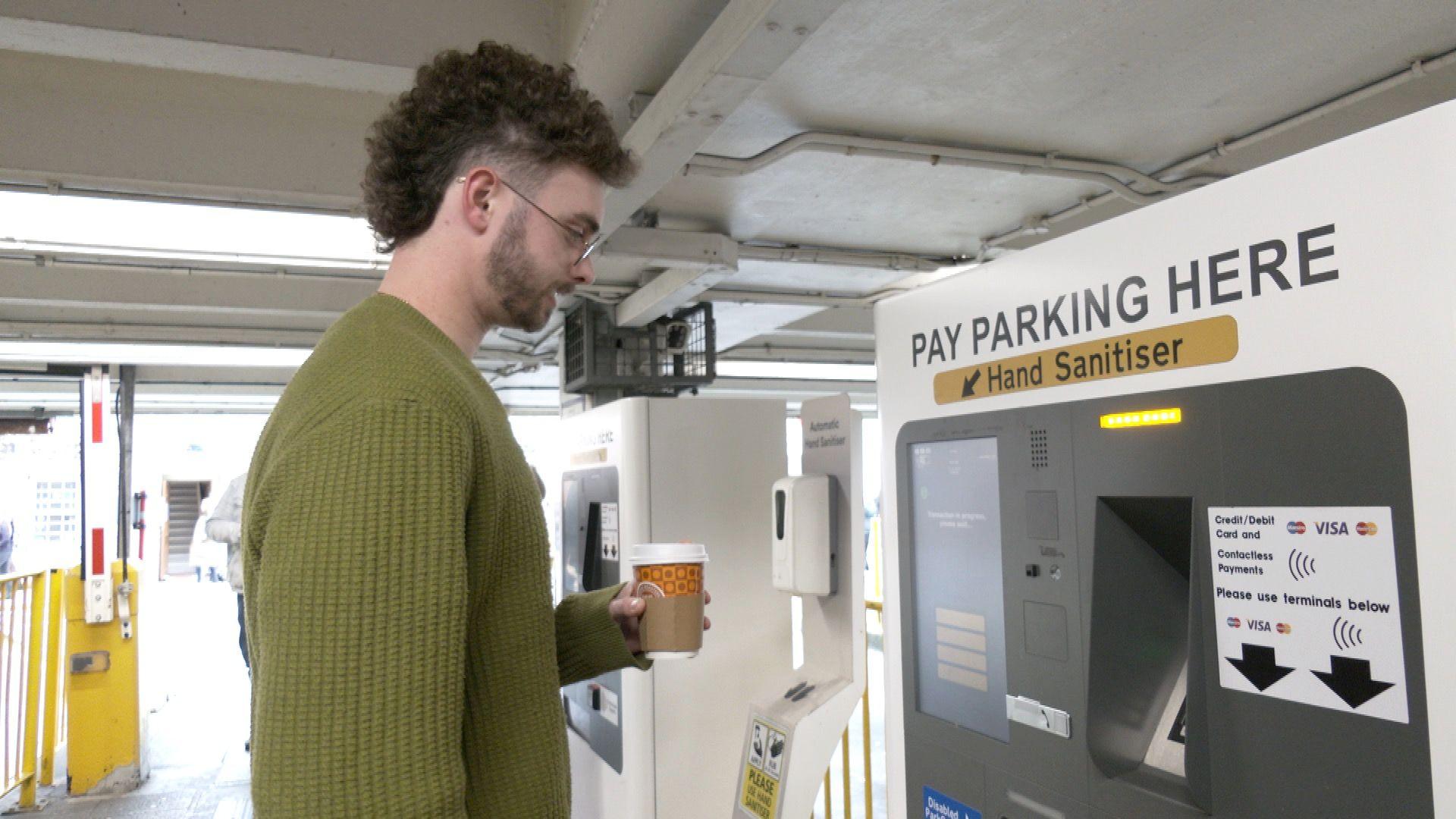 Man buys car parking ticket