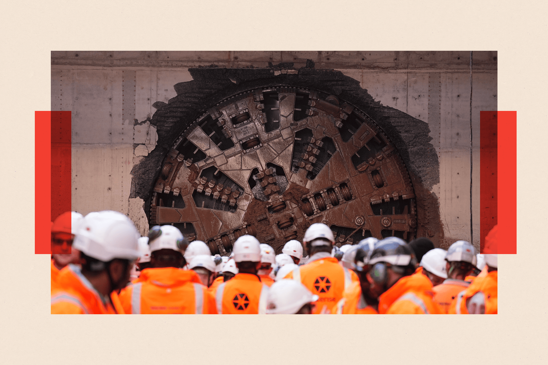 Workmen with white hats and orange jackets next to HS2 building works