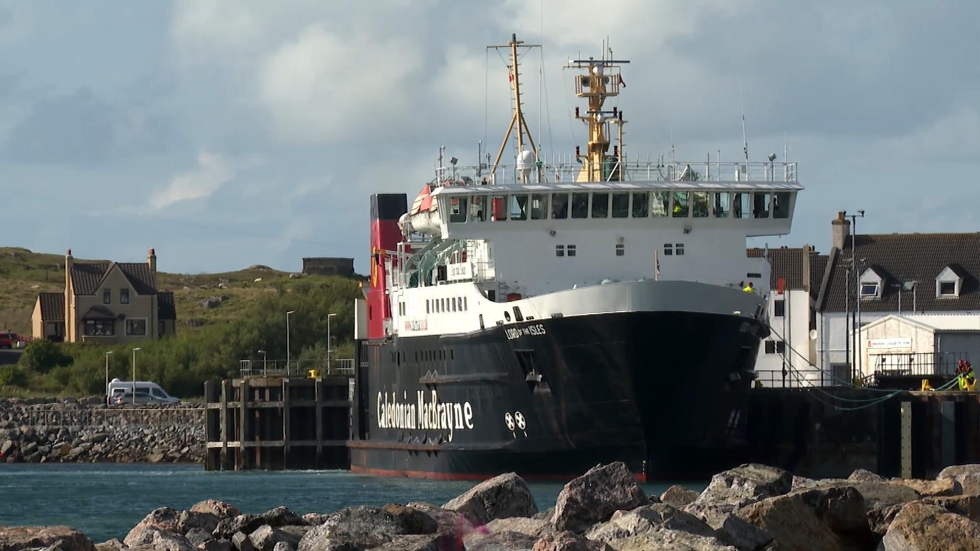 A black and white ship with red funnels