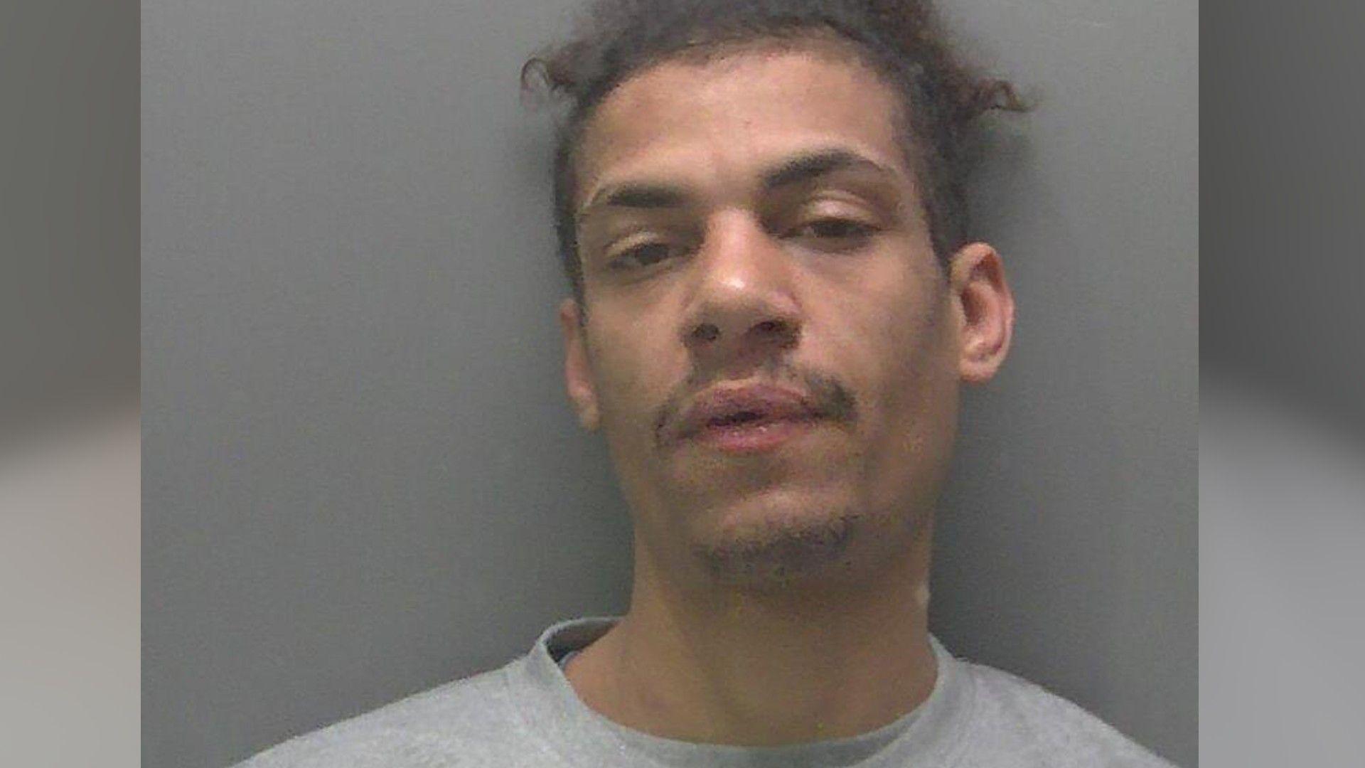Custody image of Barry- wearing a grey T-shirt 