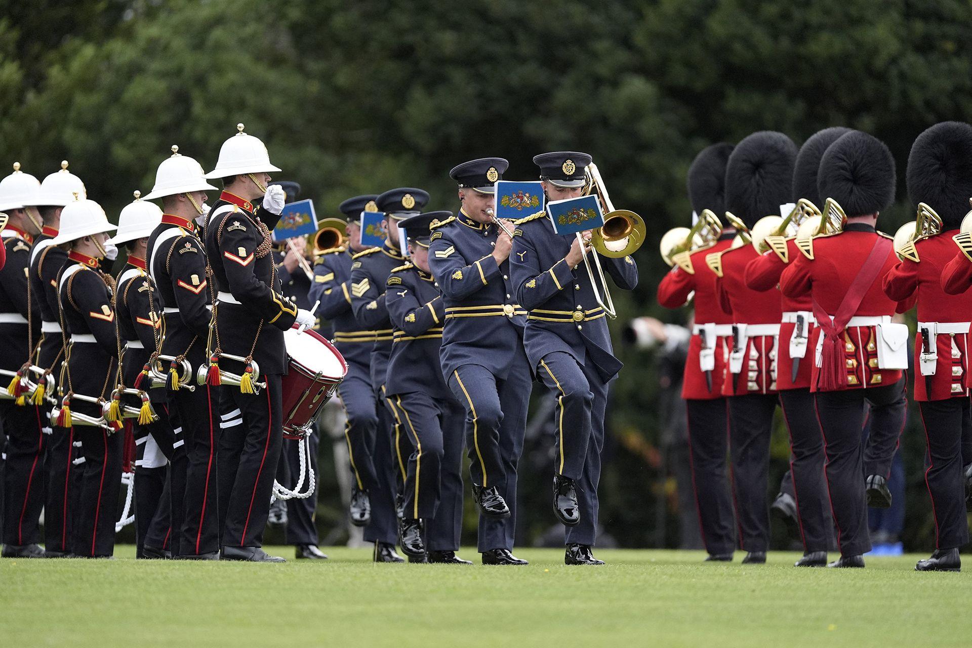 The Band of His Majesty's Royal Marines Portsmouth, the Band of the Scots Guards, British Army and the Central and College Bands of the Royal Air Force perform during a Beating Retreat military ceremony at Windsor Castle, Berkshire