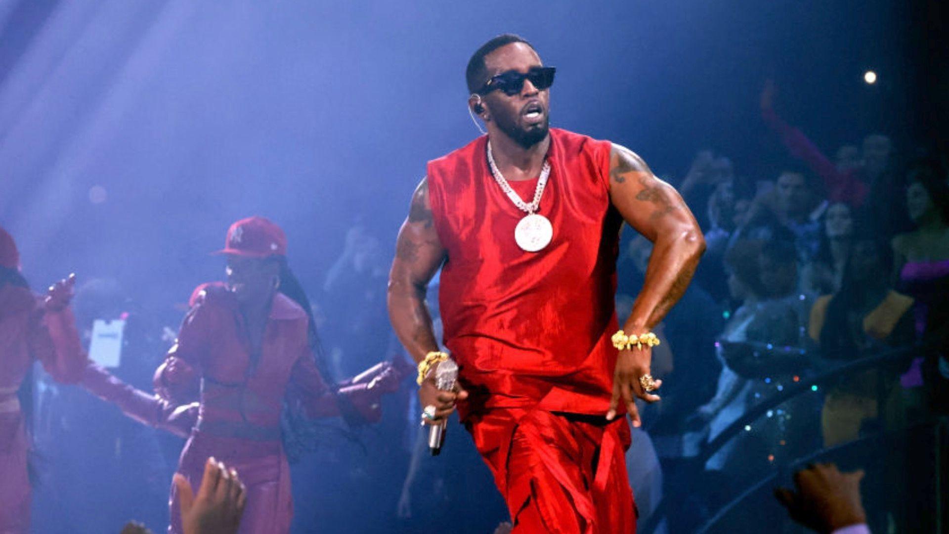 Sean Diddy Combs wearing red and big gold chain, Diddy performs onstage during the 2023 MTV Video Music Awards