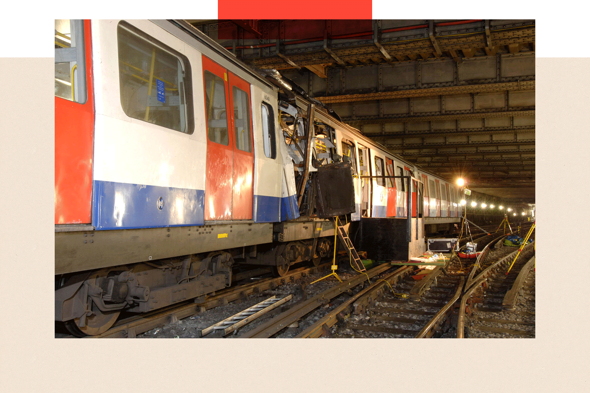 A London Underground train damaged by bombing rests on the tracks at the Aldgate tube station