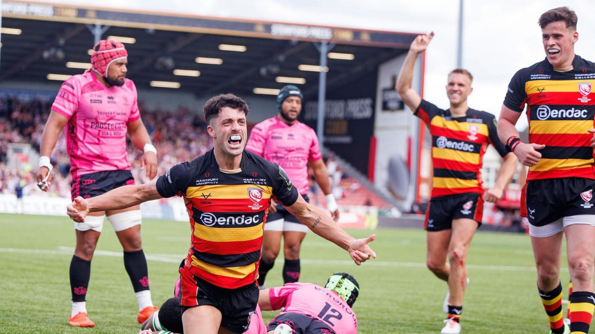 Adam Hastings celebrates a try for Gloucester against Benetton