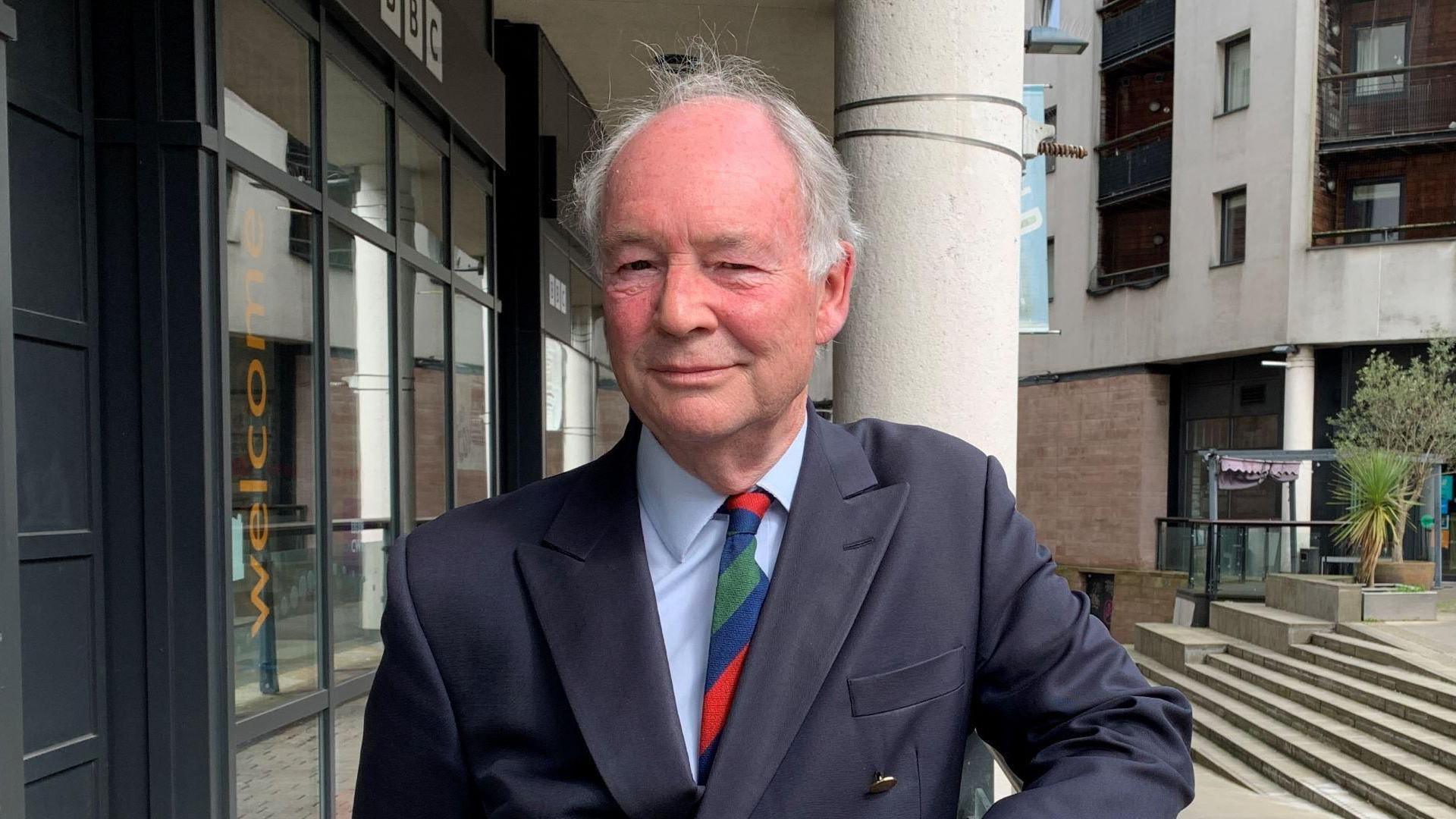 PCC Philip Seccombe, wearing a blue suit and a colourful tie