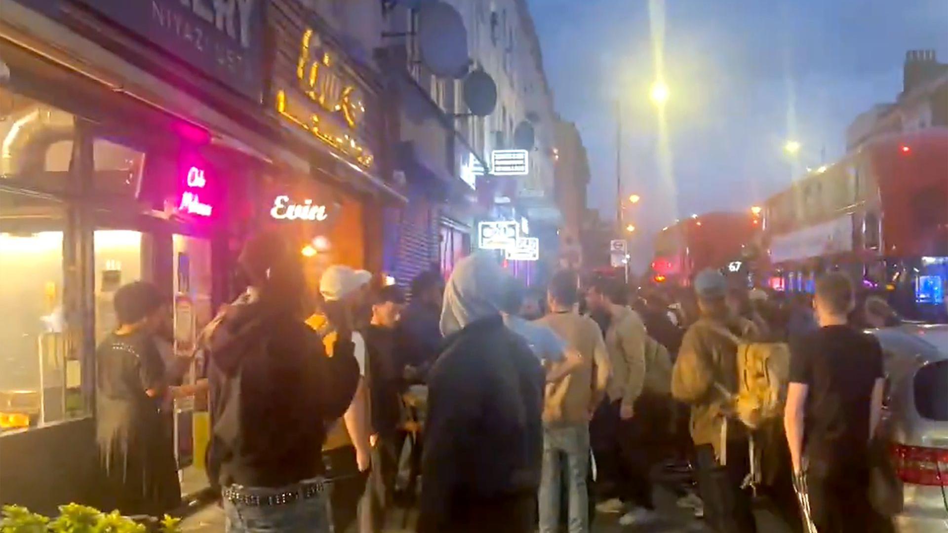 Crowds of people gathered around the scene at the restaurant last night