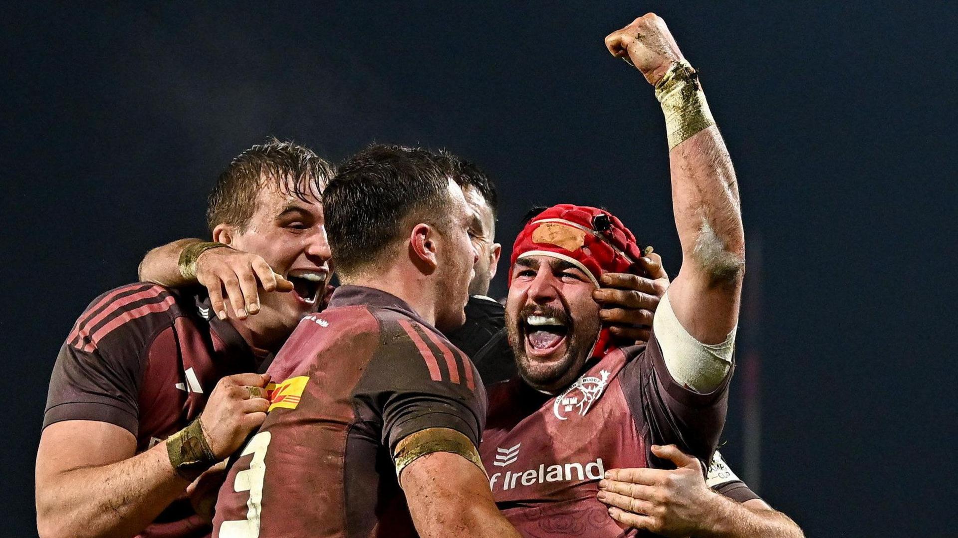 Munster players celebrate a try against Saracens