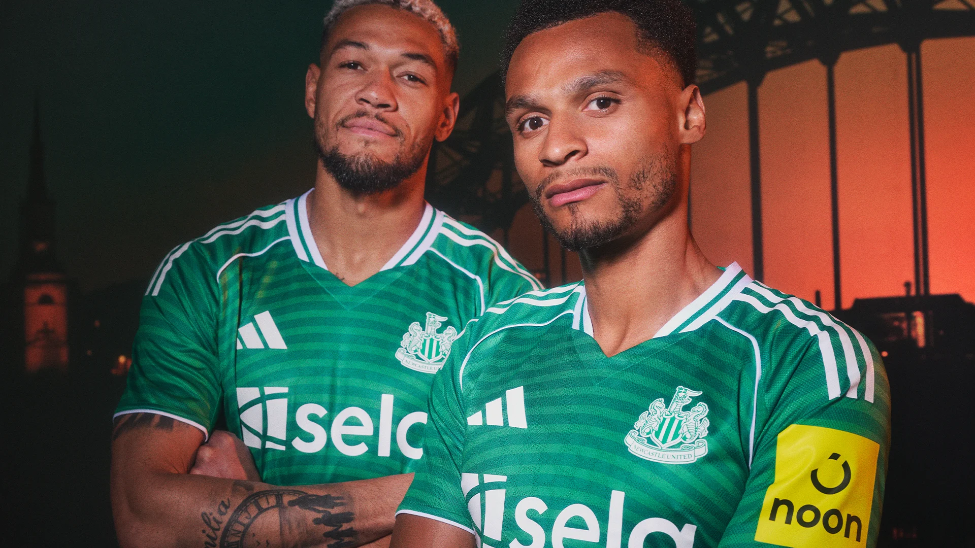 Joelinton and Jacob Murphy model the new green away kit