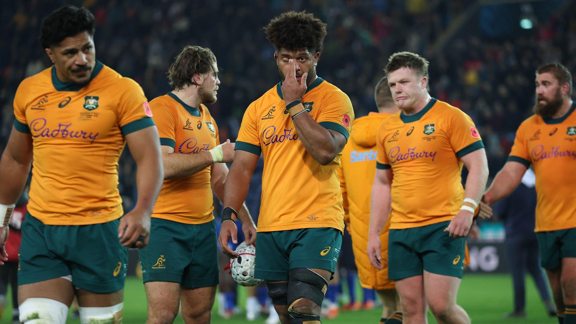 Australian players are dejected after losing to Italy 