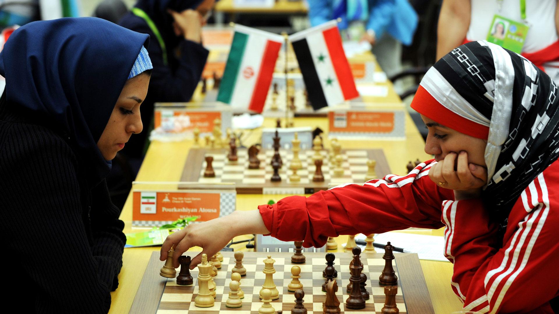 Fatemah al-Jeldah (R) of Syria makes a move against Atous Pourkashiyan of Iran, China 2010