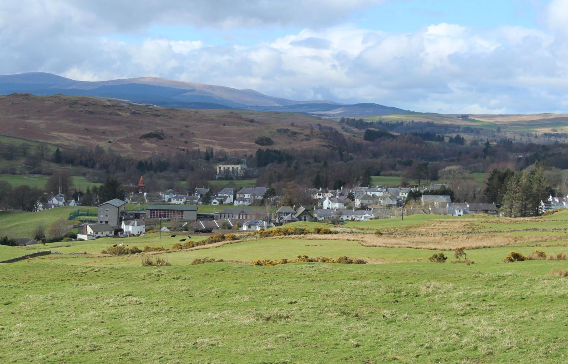 A wider view of the countryside around the town of Dalry with rolling hills and fields