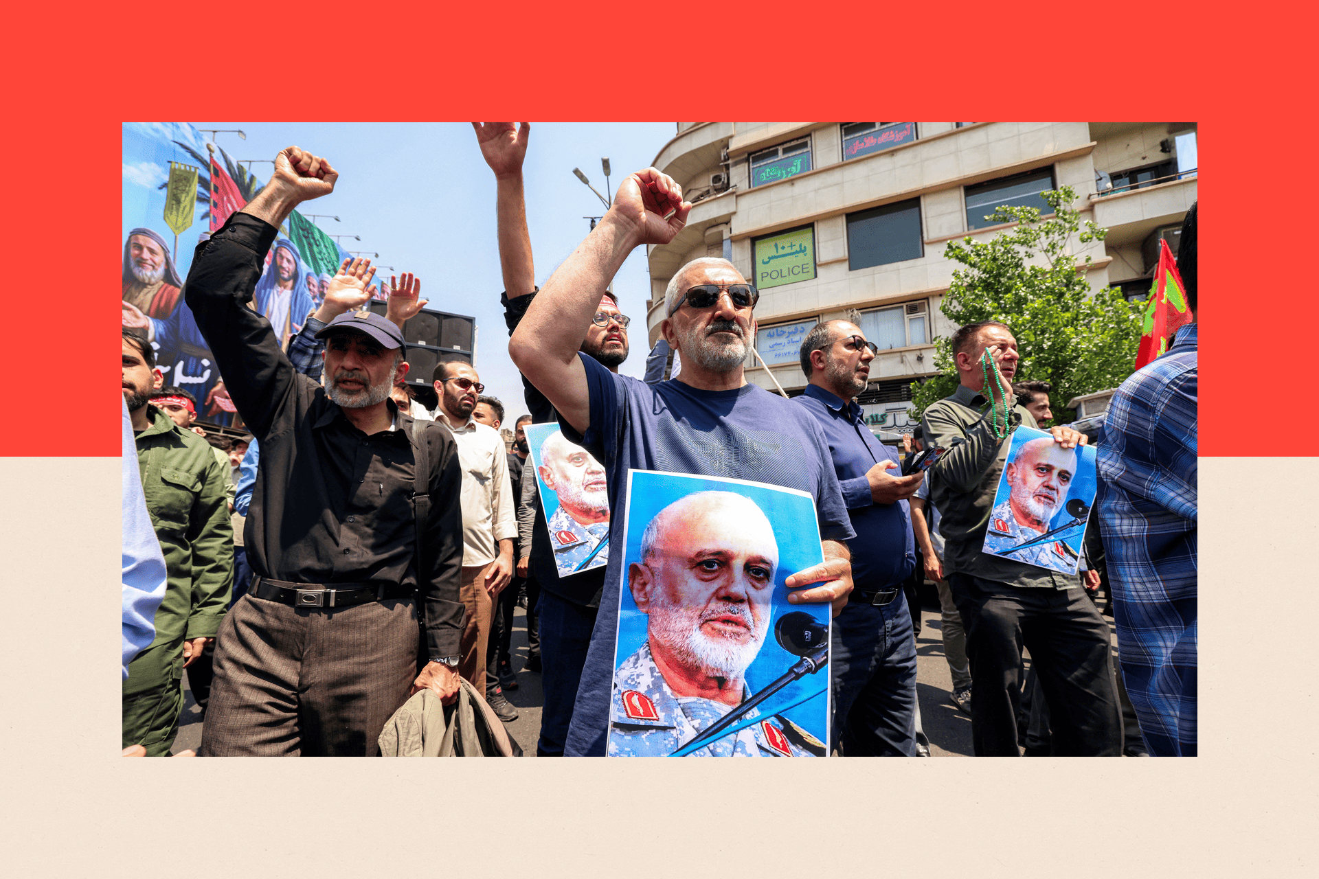 People hold pictures of Major General Gholam Ali Rashid, senior commander of Iran's Islamic Revolutionary Guard Corps (IRGC), as they gather for a protest in central Tehran on 13 June 2025