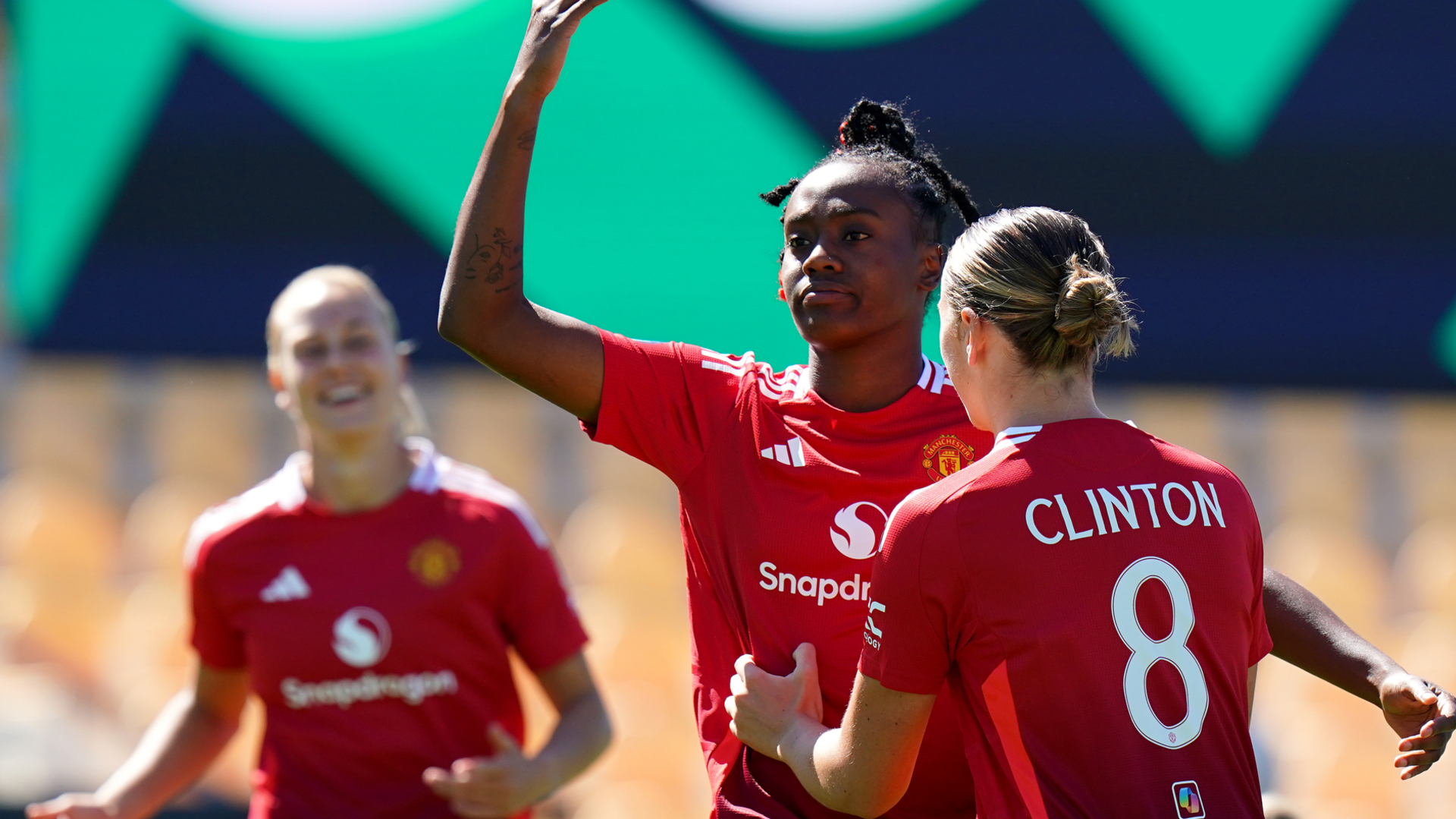 Melvine Malard of Manchester United celebrates scoring her team's first goal of the inaugural World Sevens with teammate Grace Clinton