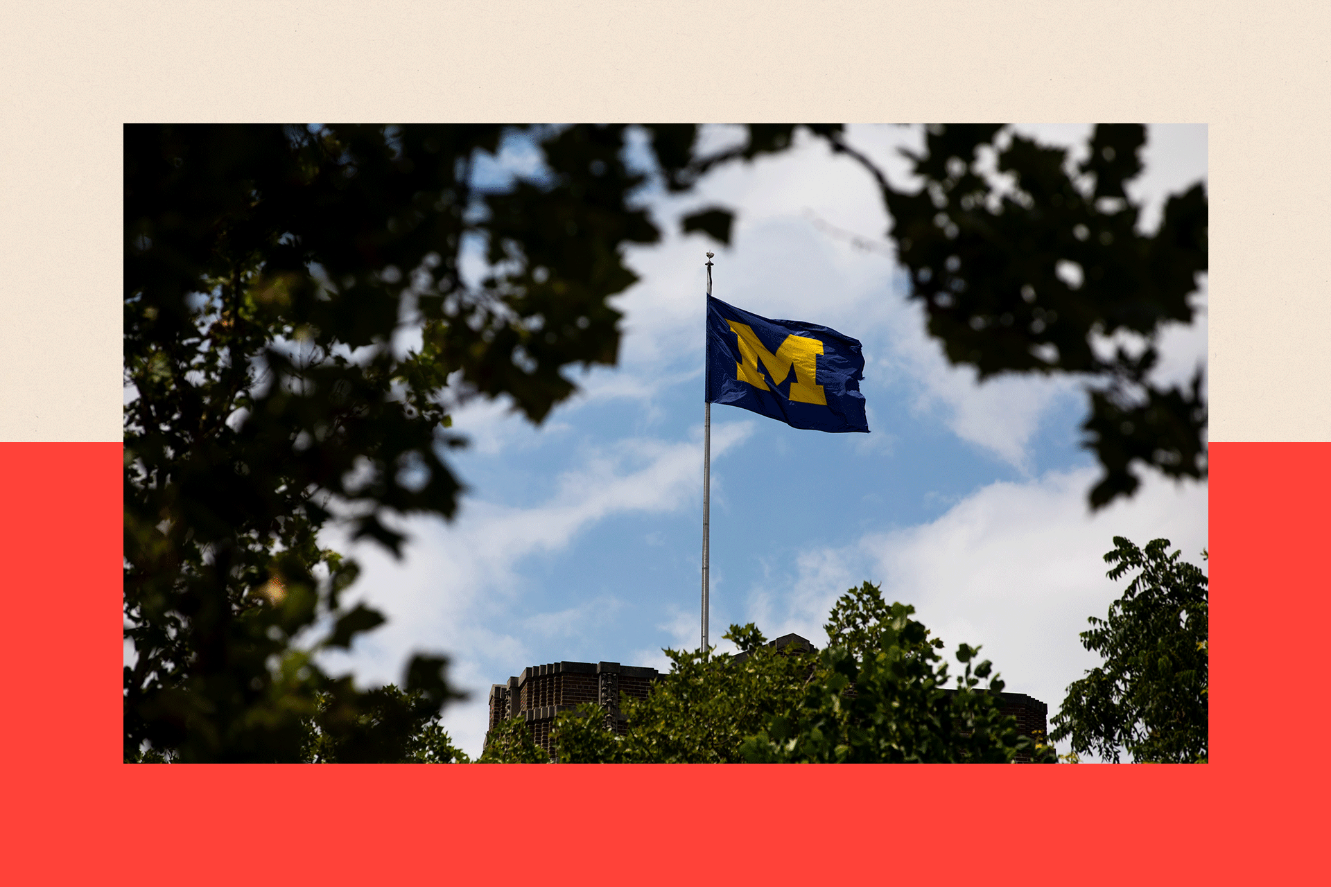 A University of Michigan flag on the Michigan Union building
