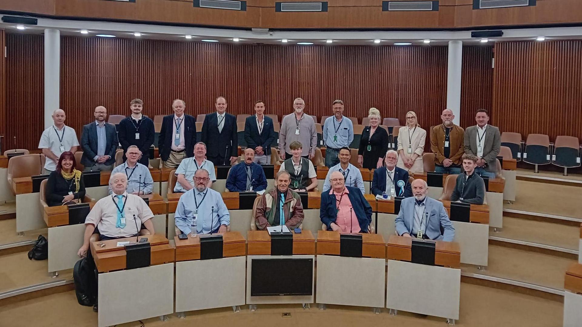 A group of councillors from Reform wearing smart clothes in County Hall
