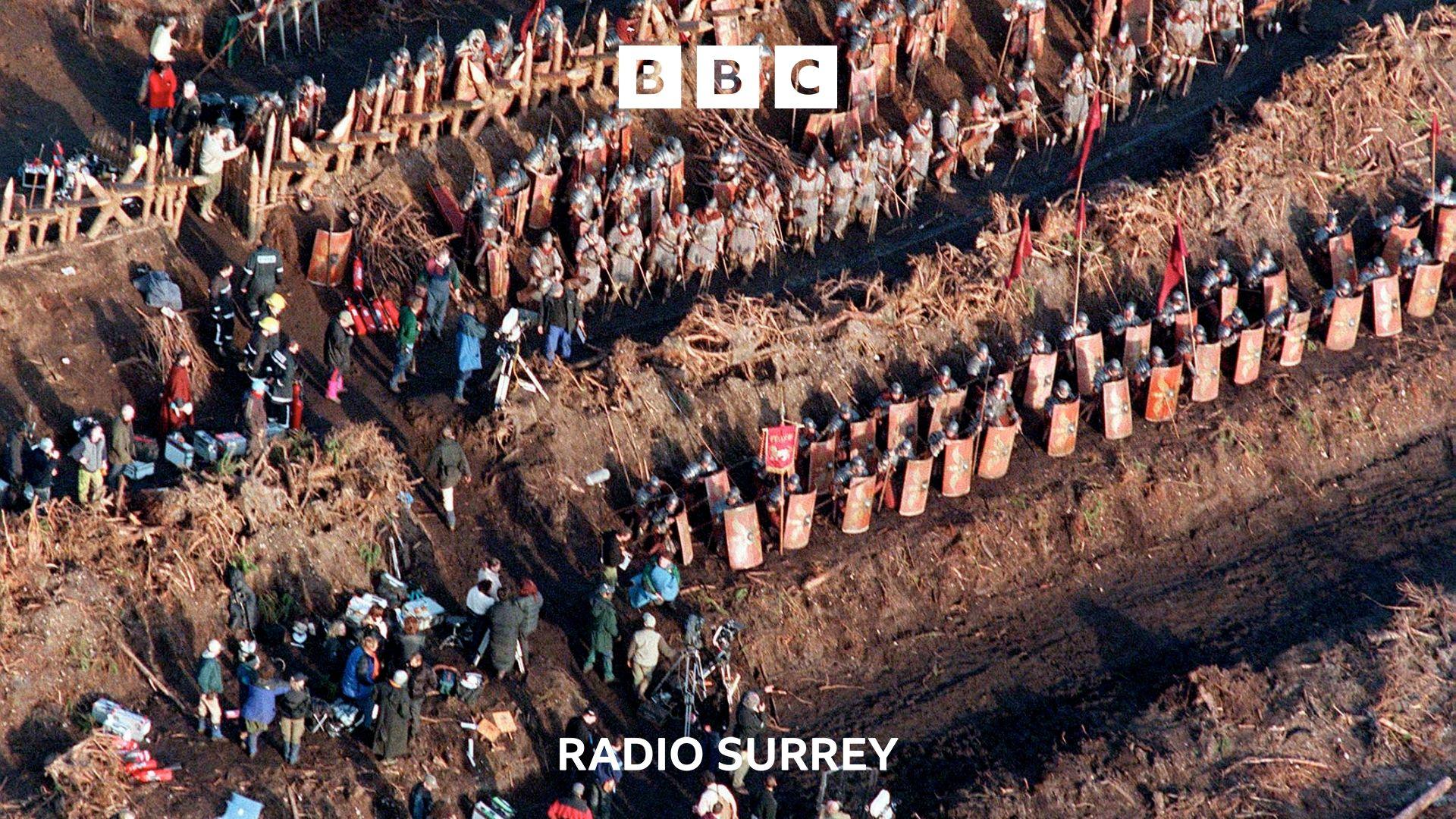 An aerial view of a battle scene from the movie Gladiator.  Lines of actors dressed as Romans can be seen along with film crew.