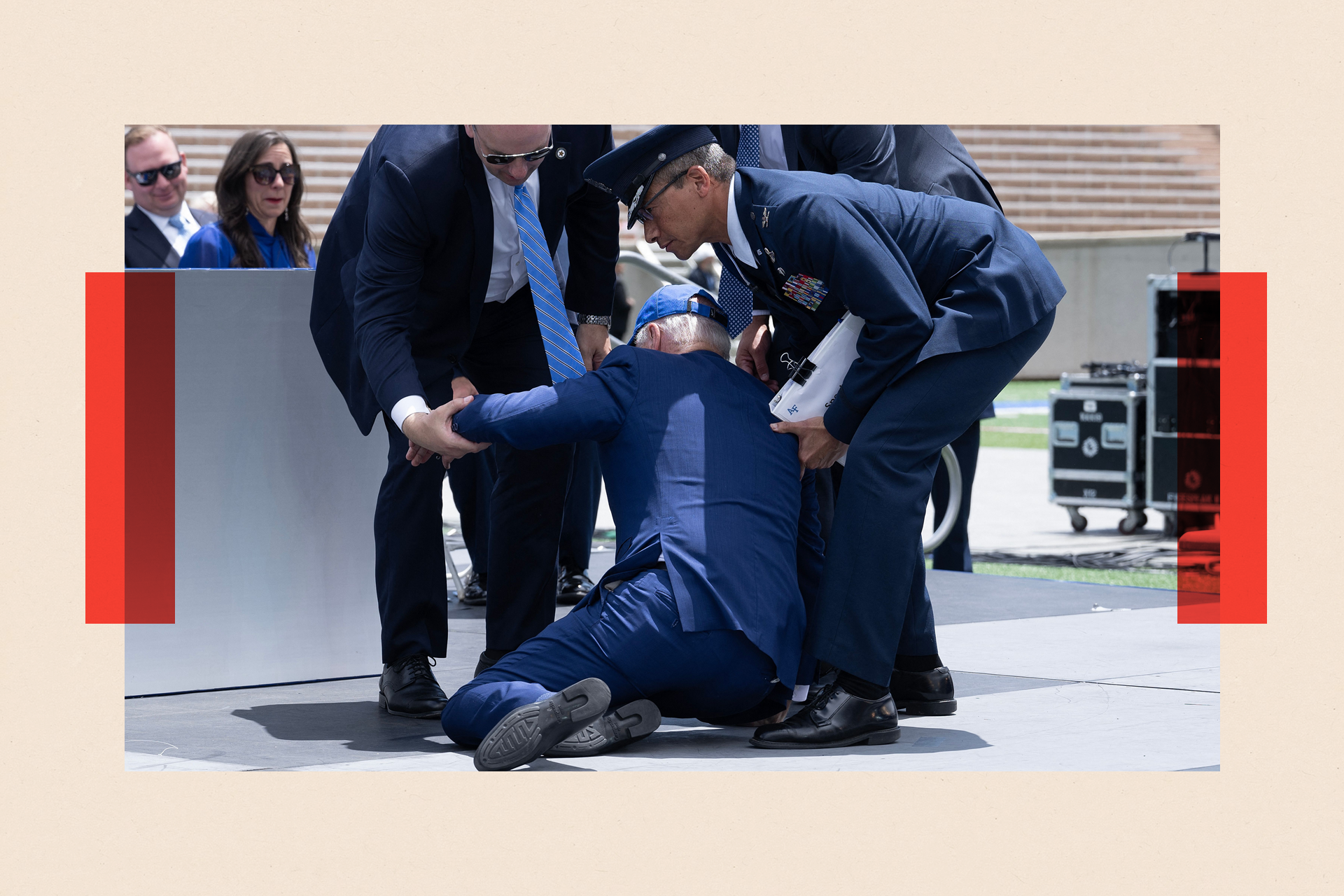 Joe Biden is helped up after falling during the graduation ceremony at the United States Air Force Academy