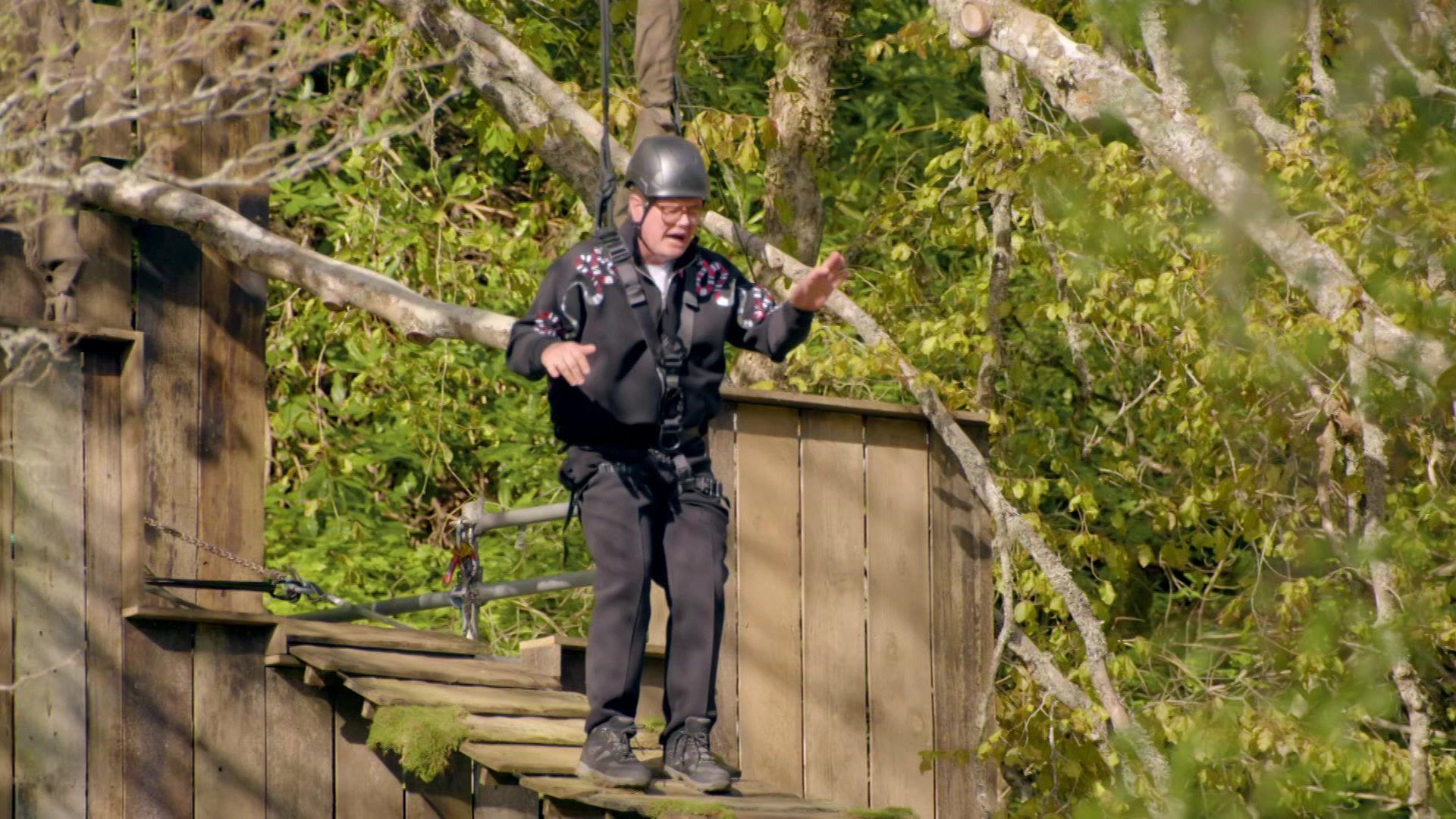 Alan Carr crossing a bridge