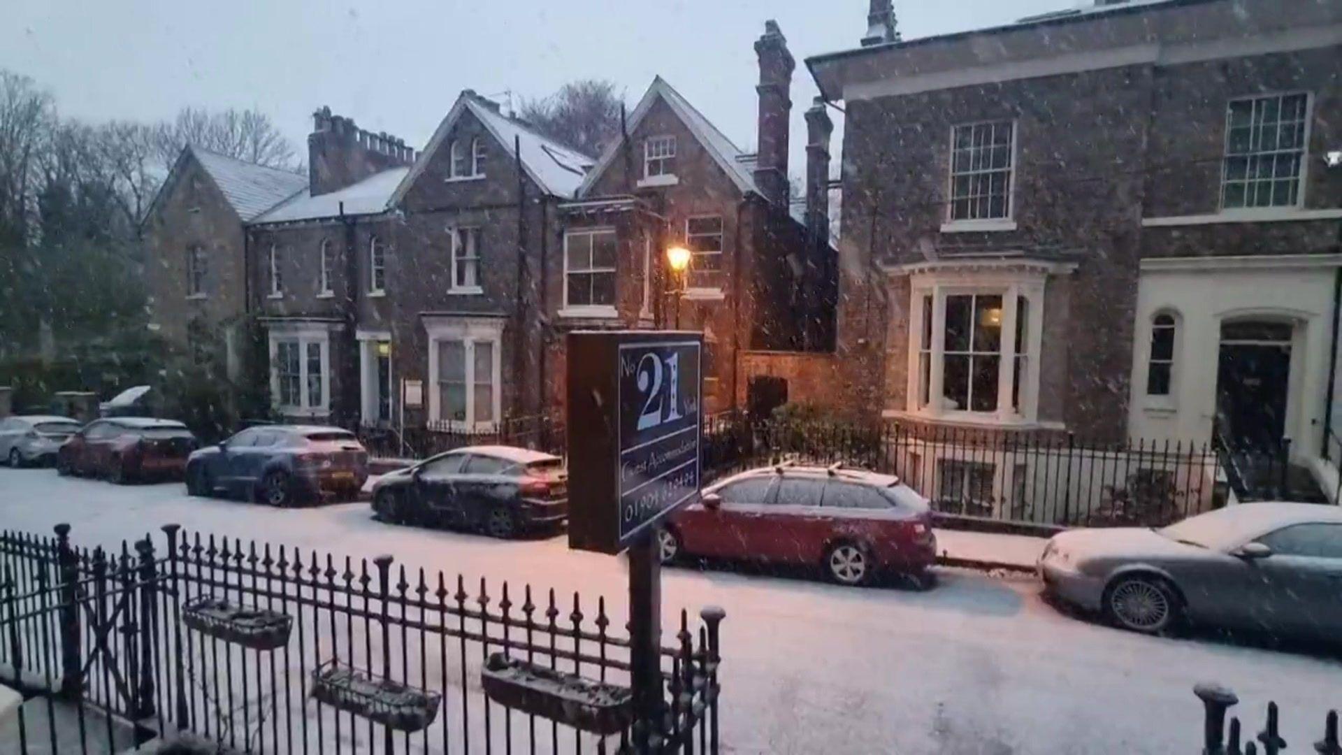 Grand houses in York with snow on the roads