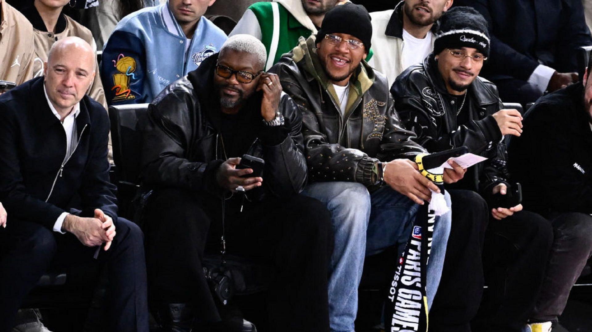 Djibril Cisse and Ciryl Gane watch basketball