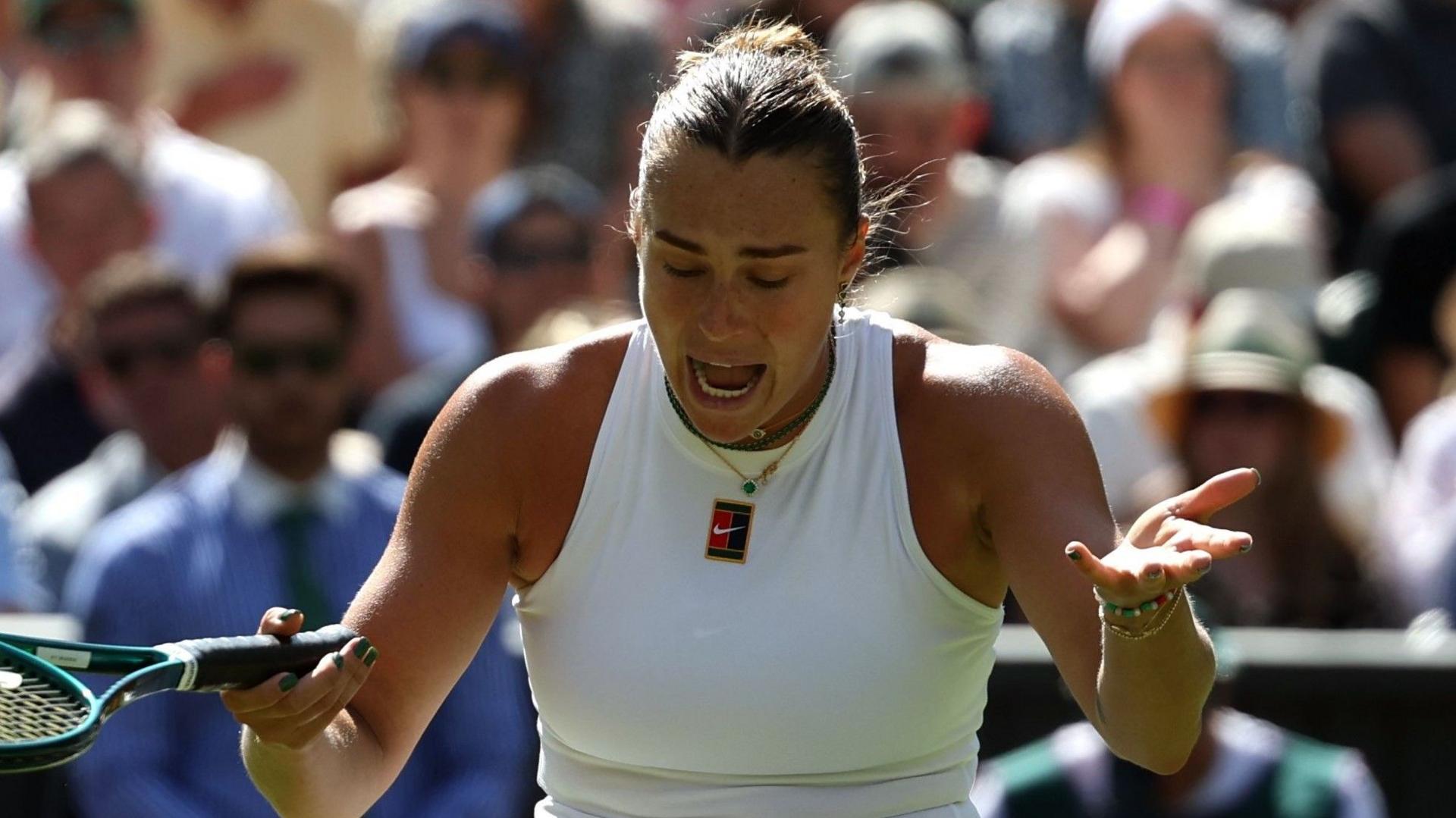Aryna Sabalenka reacts after missing a point against Laura Siegemund in the Wimbledon quarter-finals