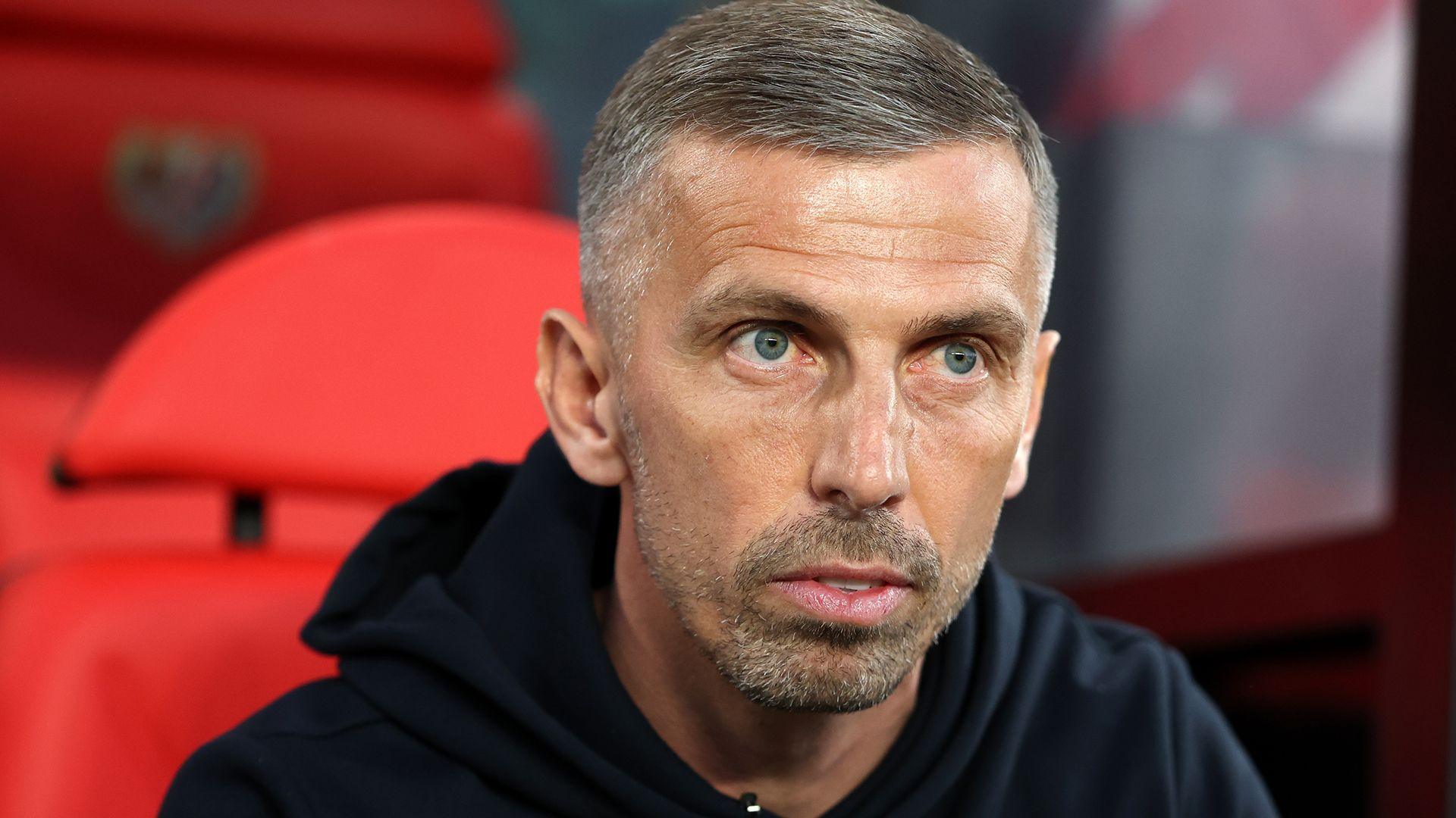 A close up of Gary O'Neill showing head and shoulders. He sits in a red chair and it wearing a black hoody.