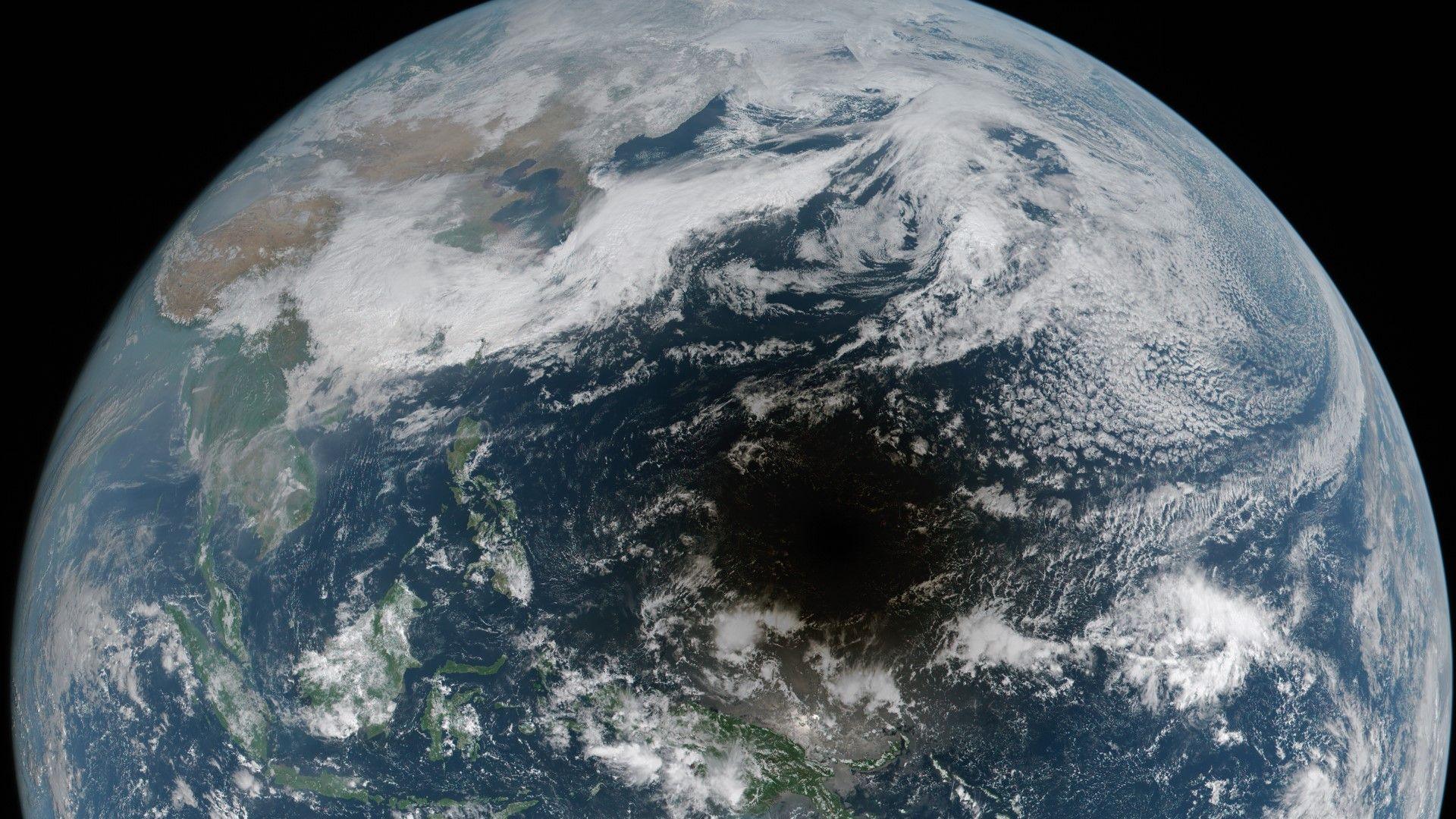 A satellite image of half of the globe with a large dark circle at the centre