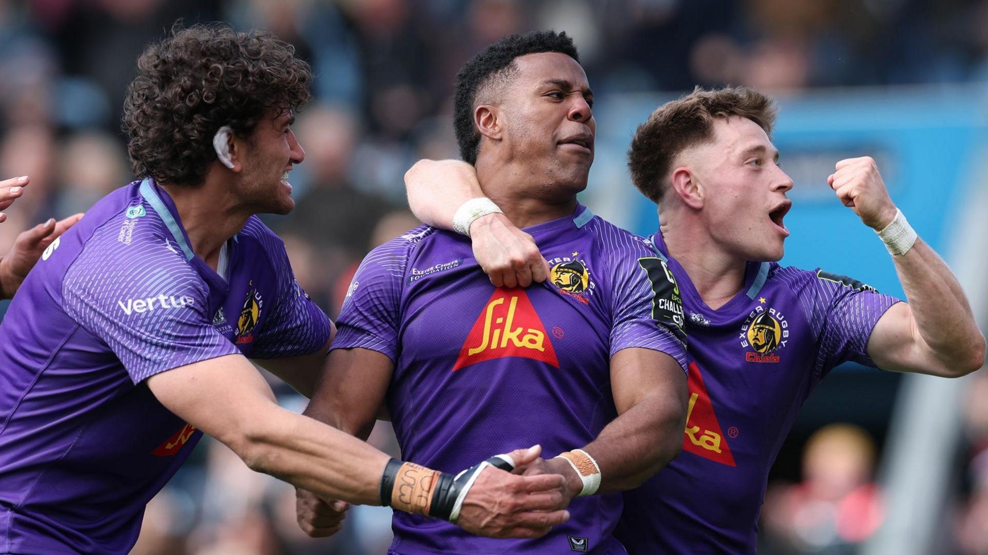 Exeter players celebrate a try