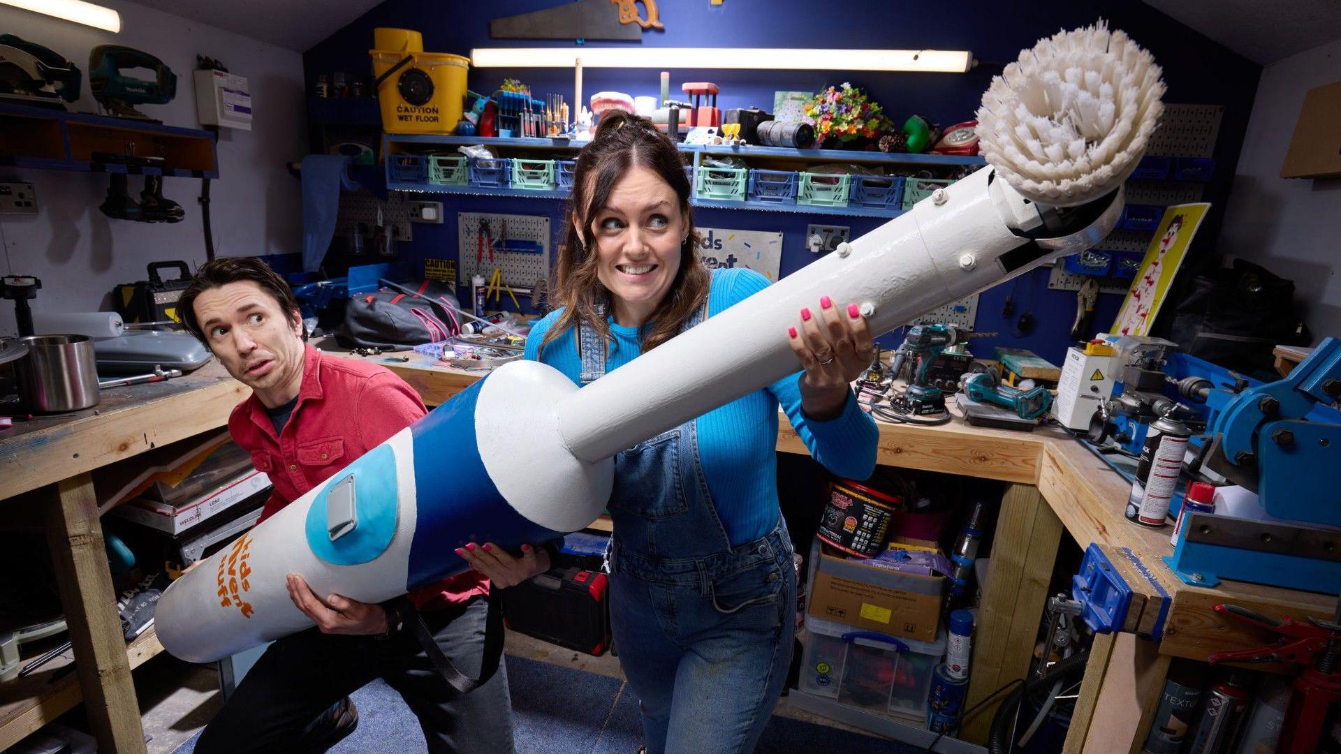 Ruth Amos and Shawn Brown with the record-breaking toothbrush