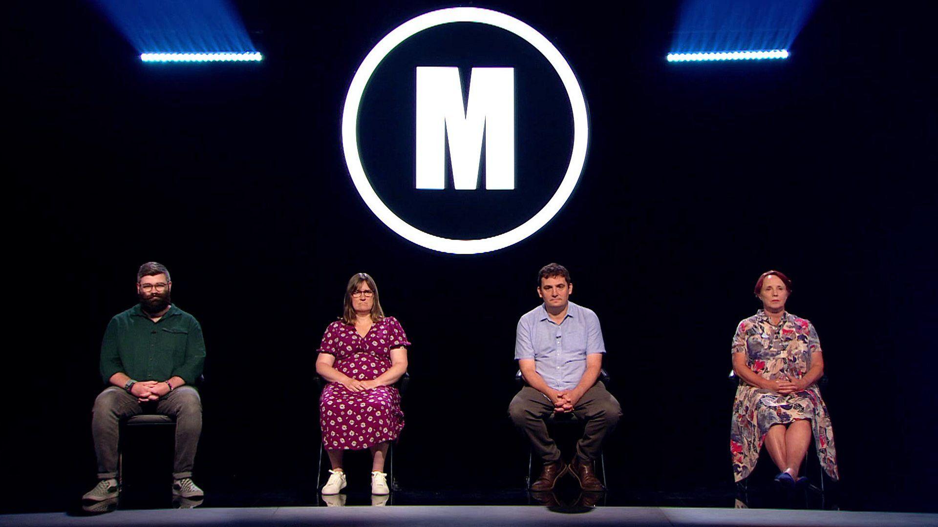 Four Mastermind contestants seated in a studio with the programme logo hanging above them.