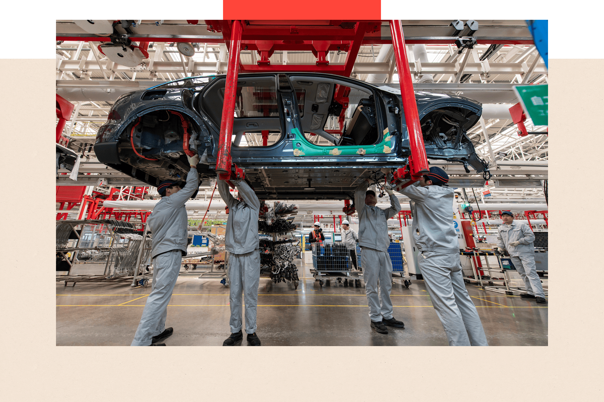 Employees assemble new energy vehicles at a factory in China