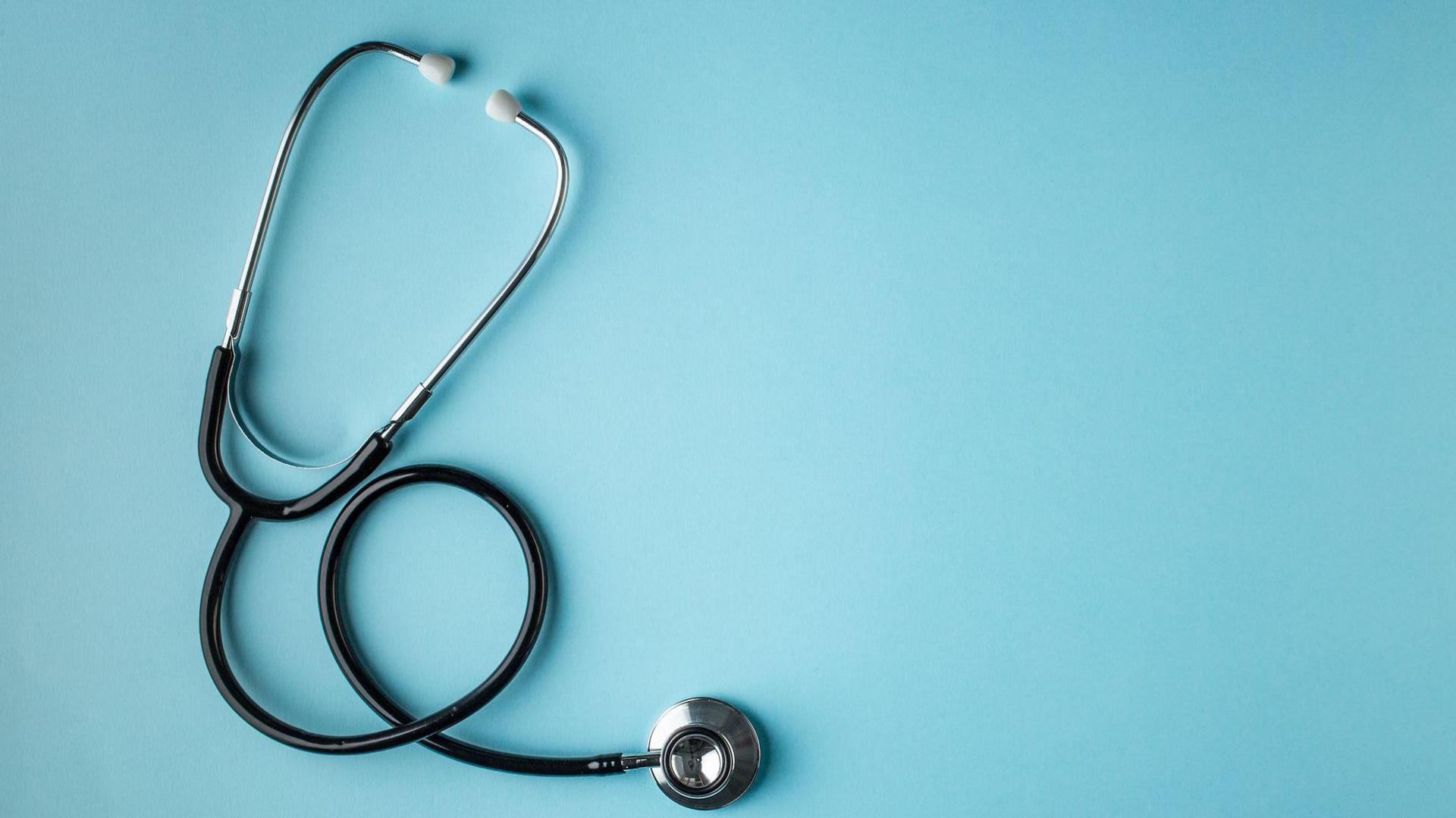 Stethoscope against blue background