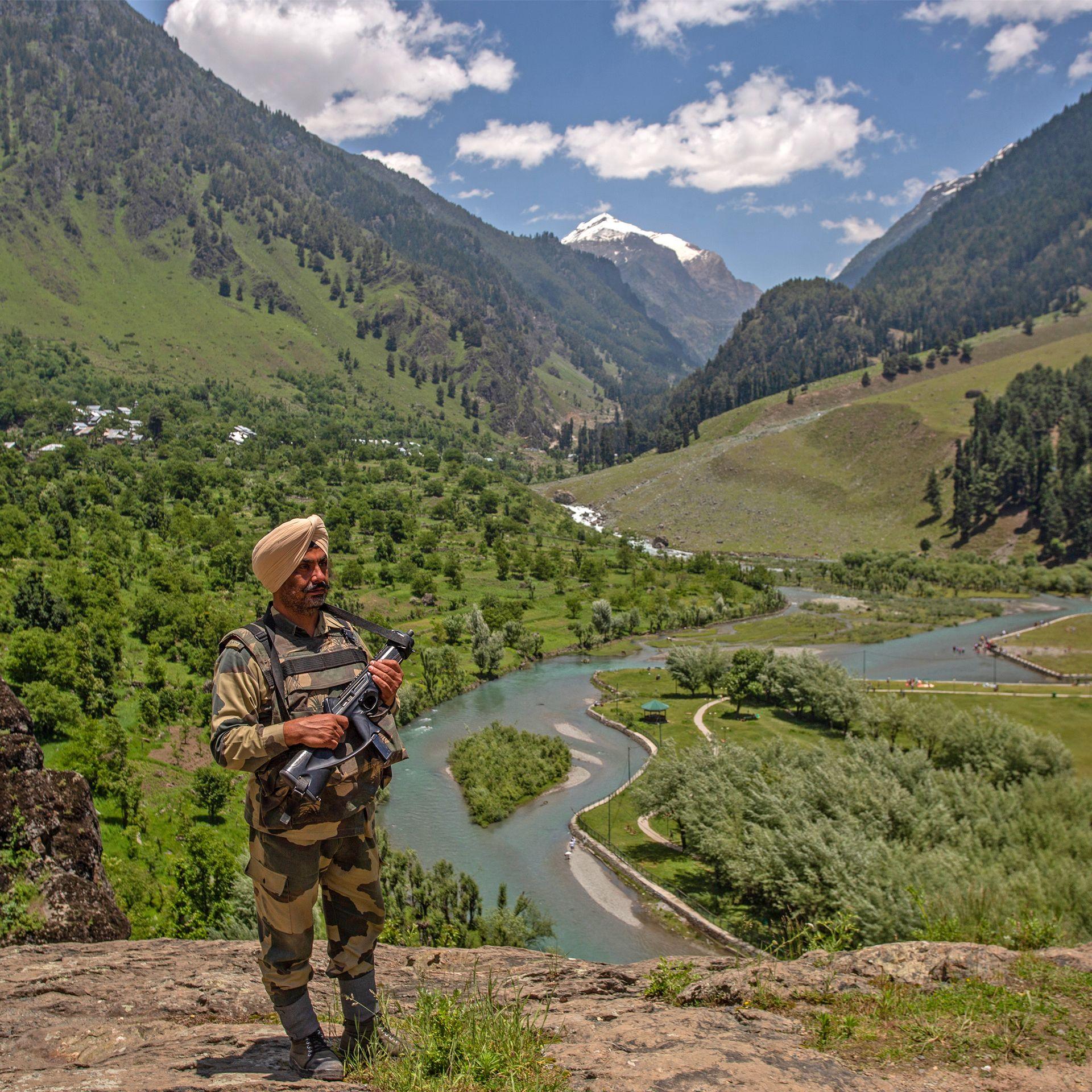 A soldier stands guard in the Betab Valley in Pahalgam