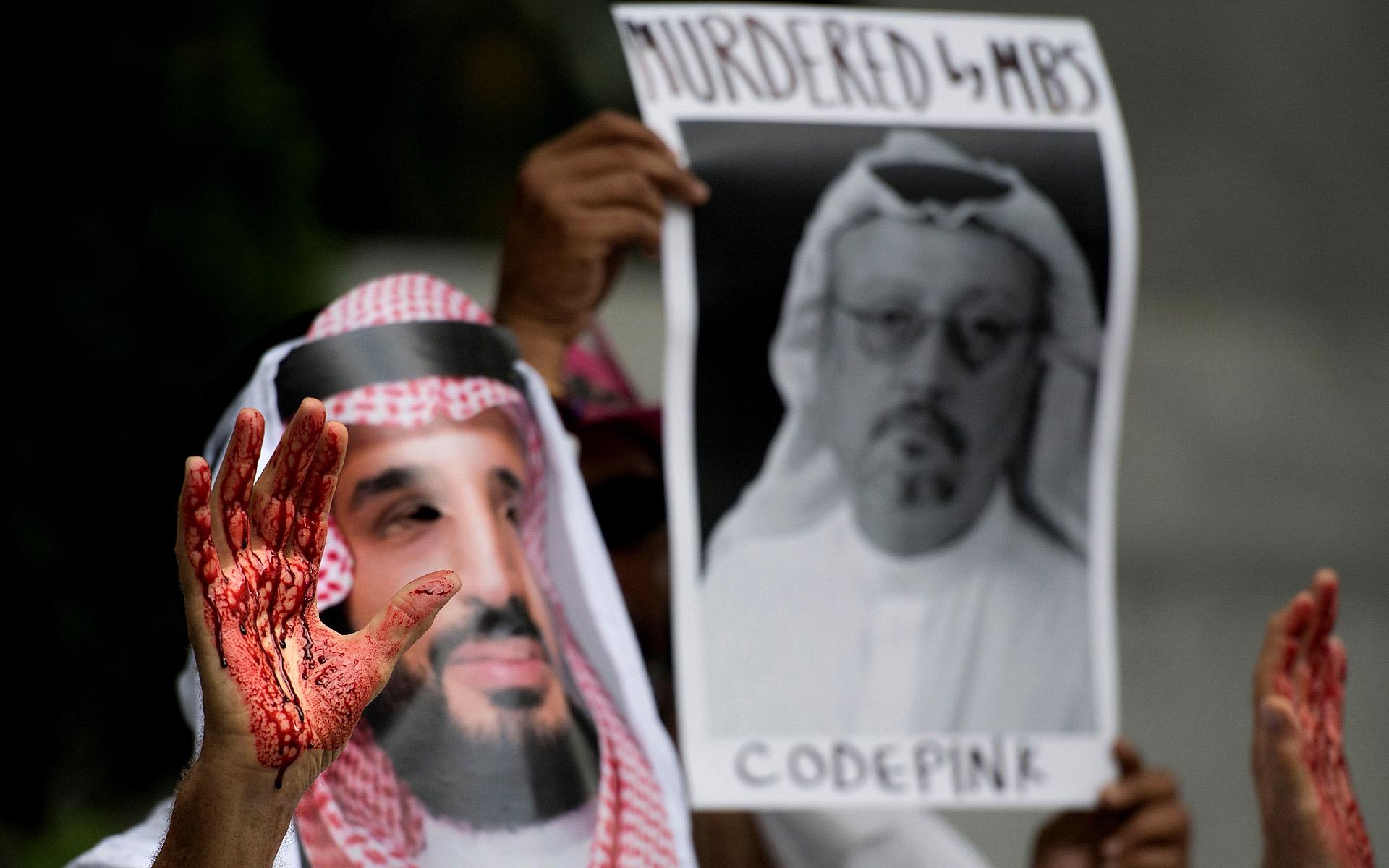 A demonstrator dressed as Saudi Arabian Crown Prince Mohammed bin Salman with blood on his hands protests outside the Saudi Embassy in Washington DC, October 2018