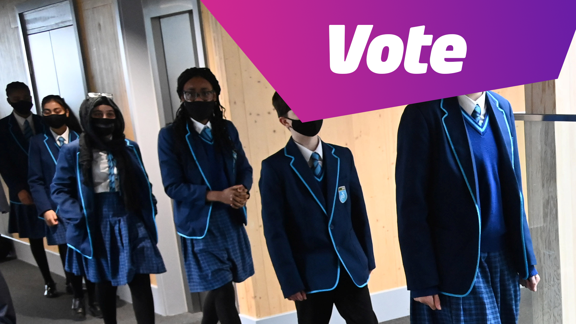 vote students wearing facemasks.