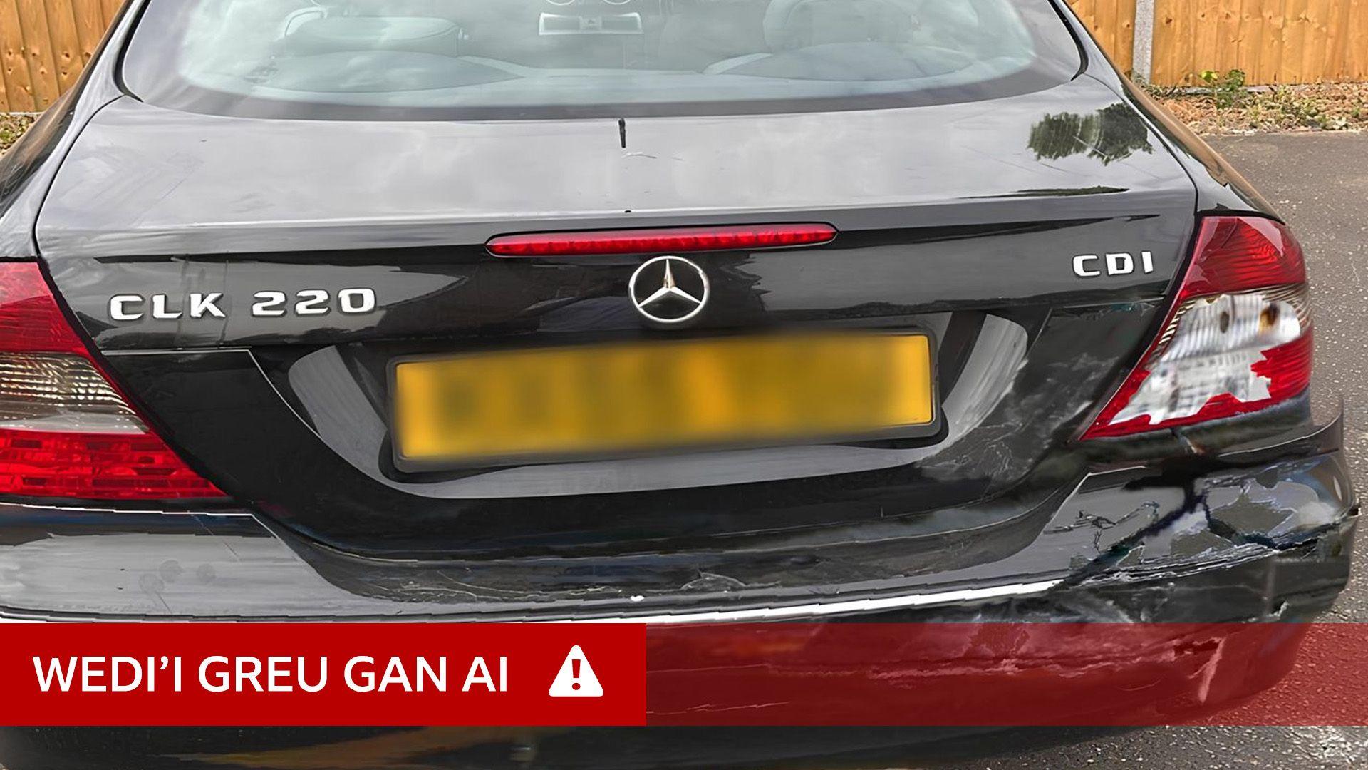 Difrod i gar, wedi'i greu gan AI