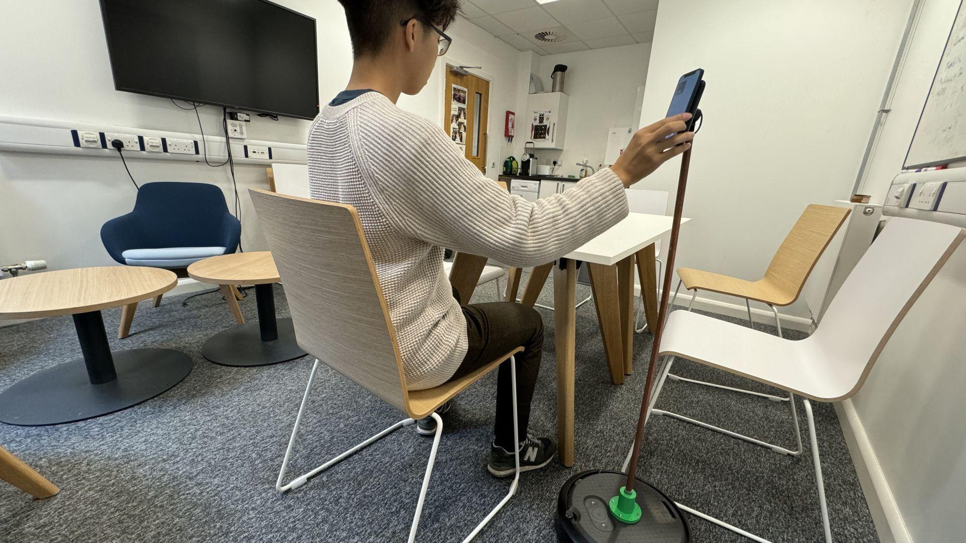 A mobile phone charger attached to the vacuum