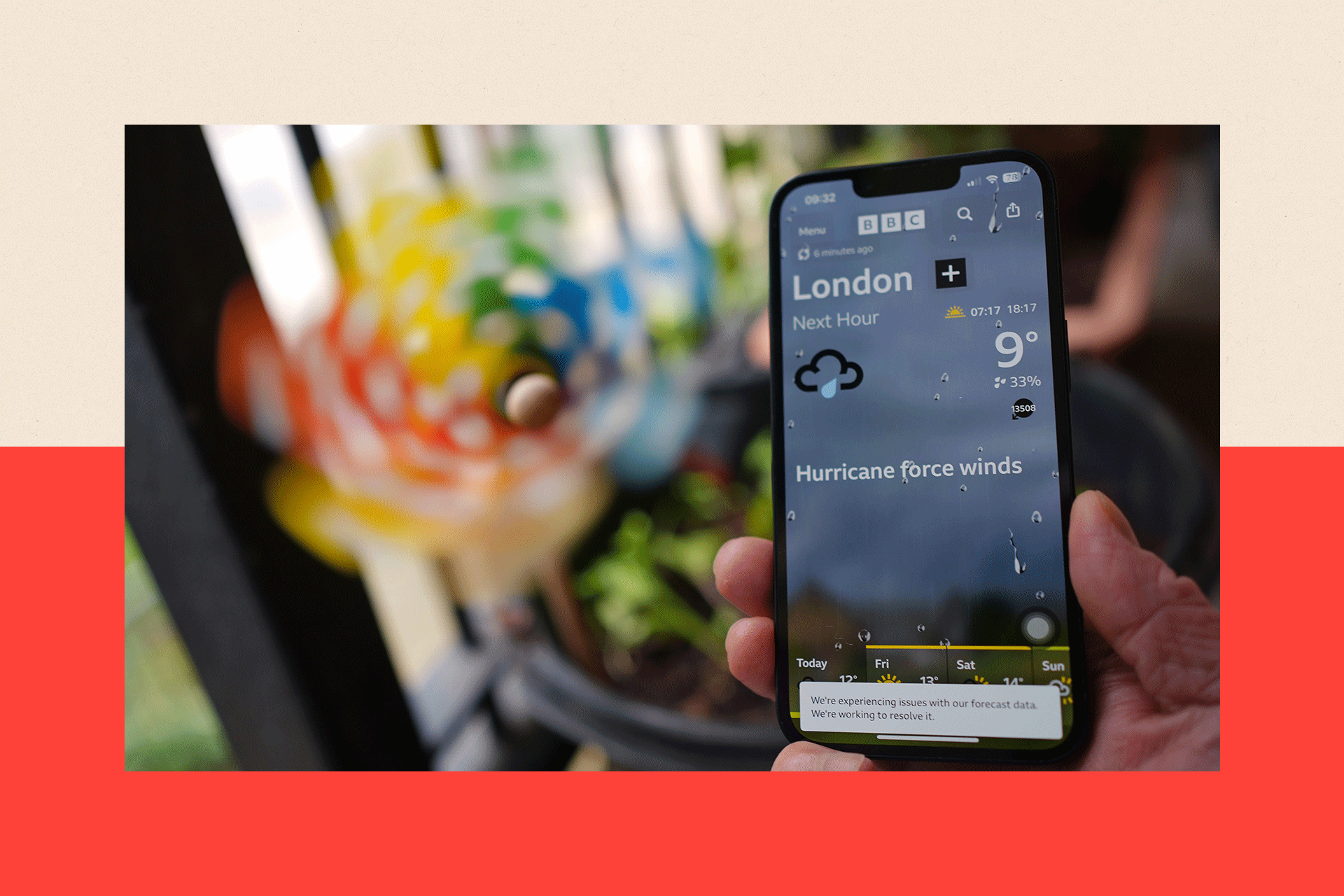 A photo of a phone showing the BBC Weather app.