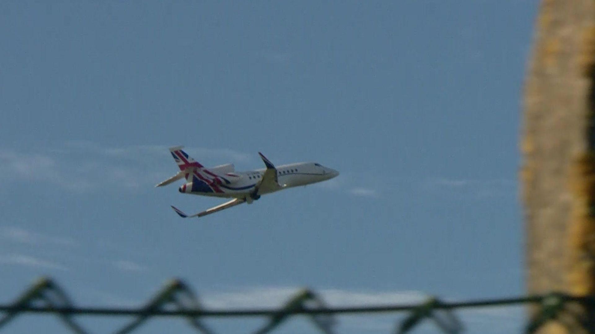 A plane taking off with a Union Jack on the tail