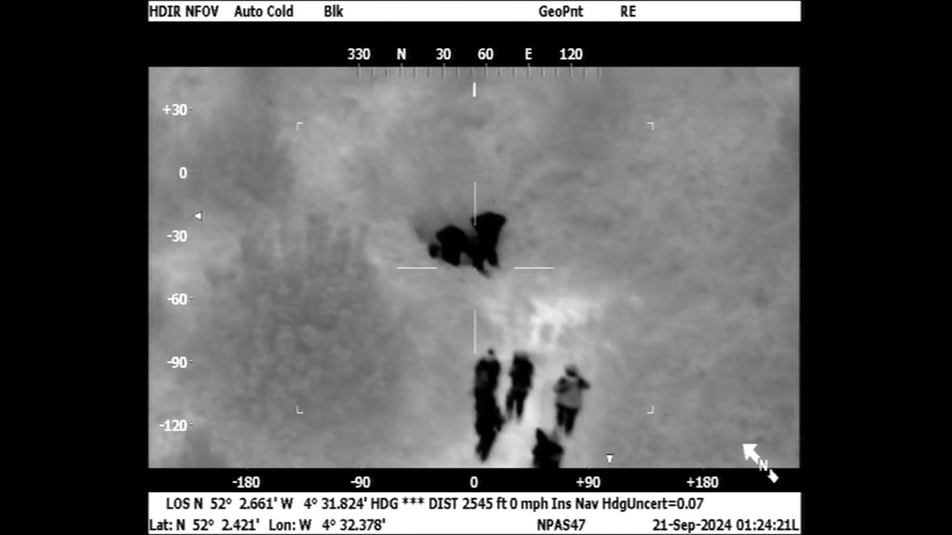 Police helicopter footage of two men Geraint Berry, 46, from Swansea, and Steven Thomas, 47, from Blaengwynfi, Neath Port Talbot. Who were hiding in undergrowth near a caravan site in Cenarth, Wales.