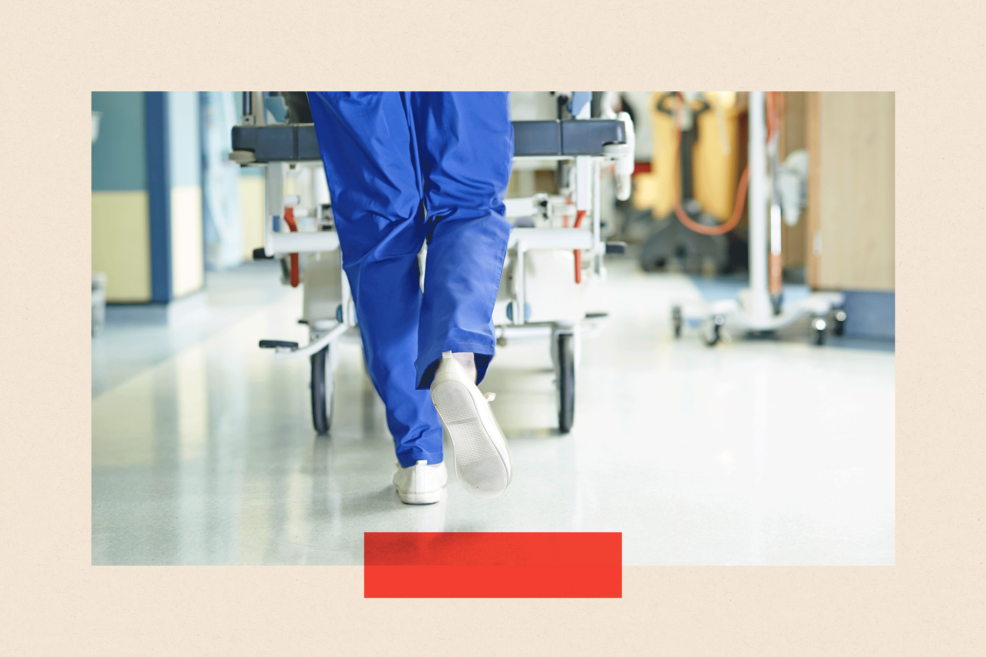 A shot of the legs of a medic running with hospital bed along a hospital corridor