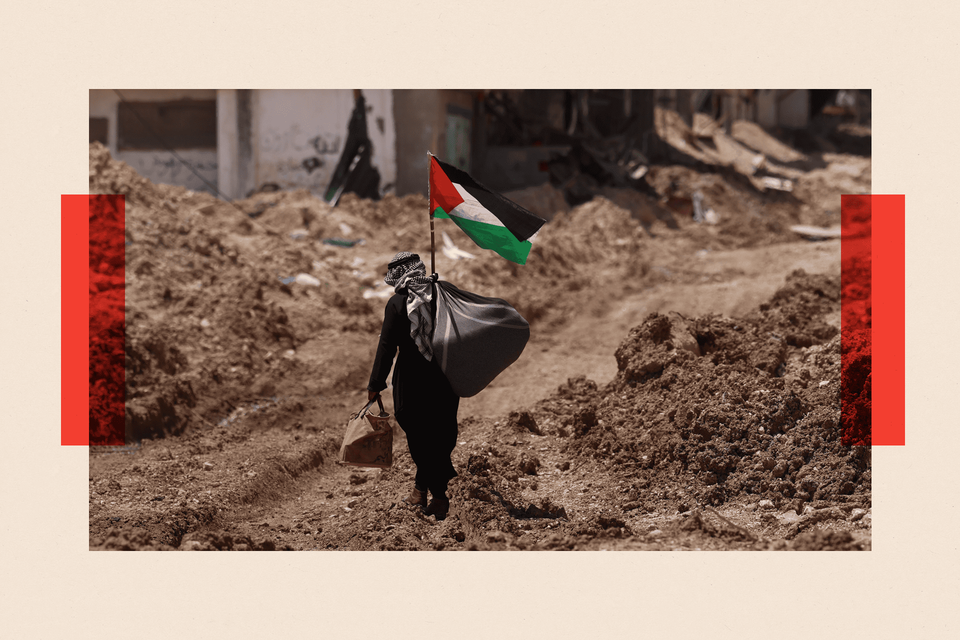 A Palestinian man walks pass the main entrance of Tulkarem refugee camp in the West Bank city of Tulkarem