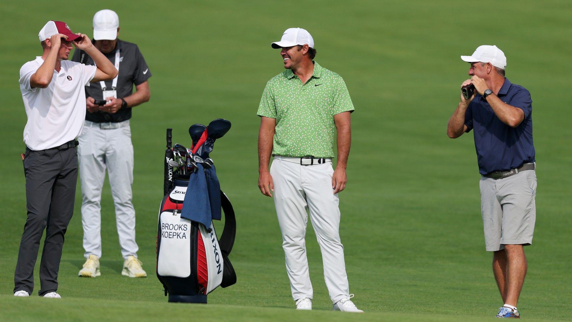 English amateur Tyler Weaver chatting with two-time US Open winner Brooks Koepka during a practice round at Oakmont.